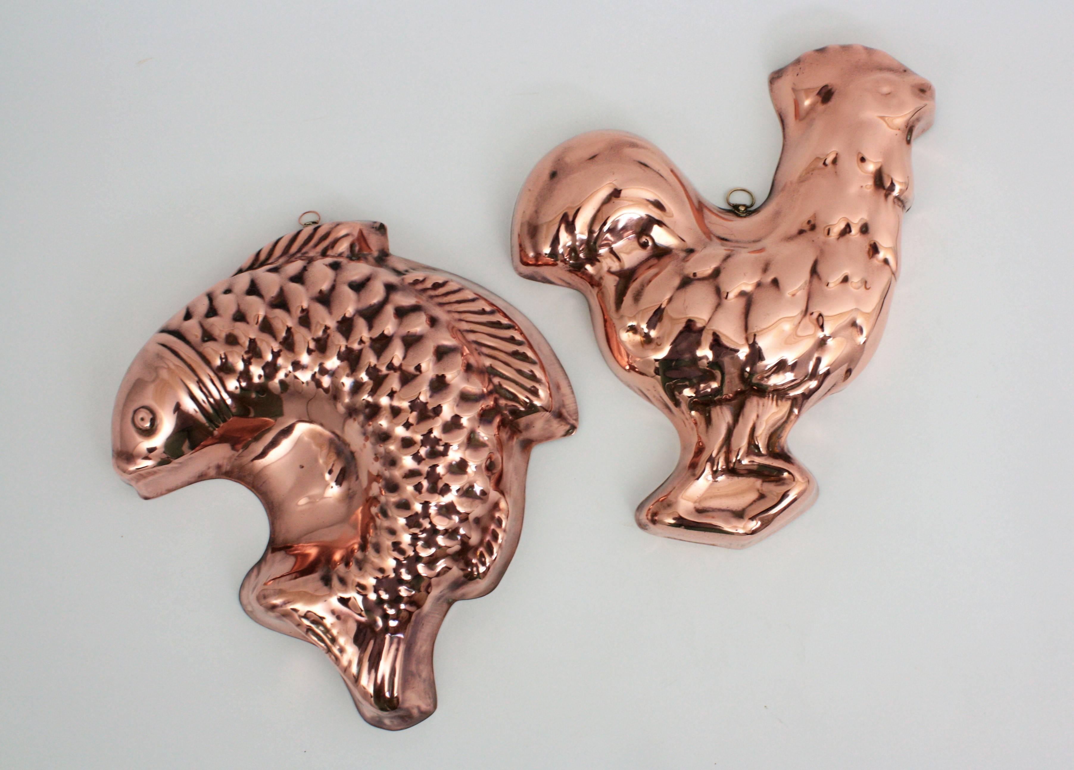 A beautiful set of two cake copper molds. One of them with fish shape and the other with cock shape.
Portugal, 1920s.

Dimensions: Fish 27 cm H, 24 cm W, 5 cm D
Cock 28 cm H, 24 cm W, 4 cm D.