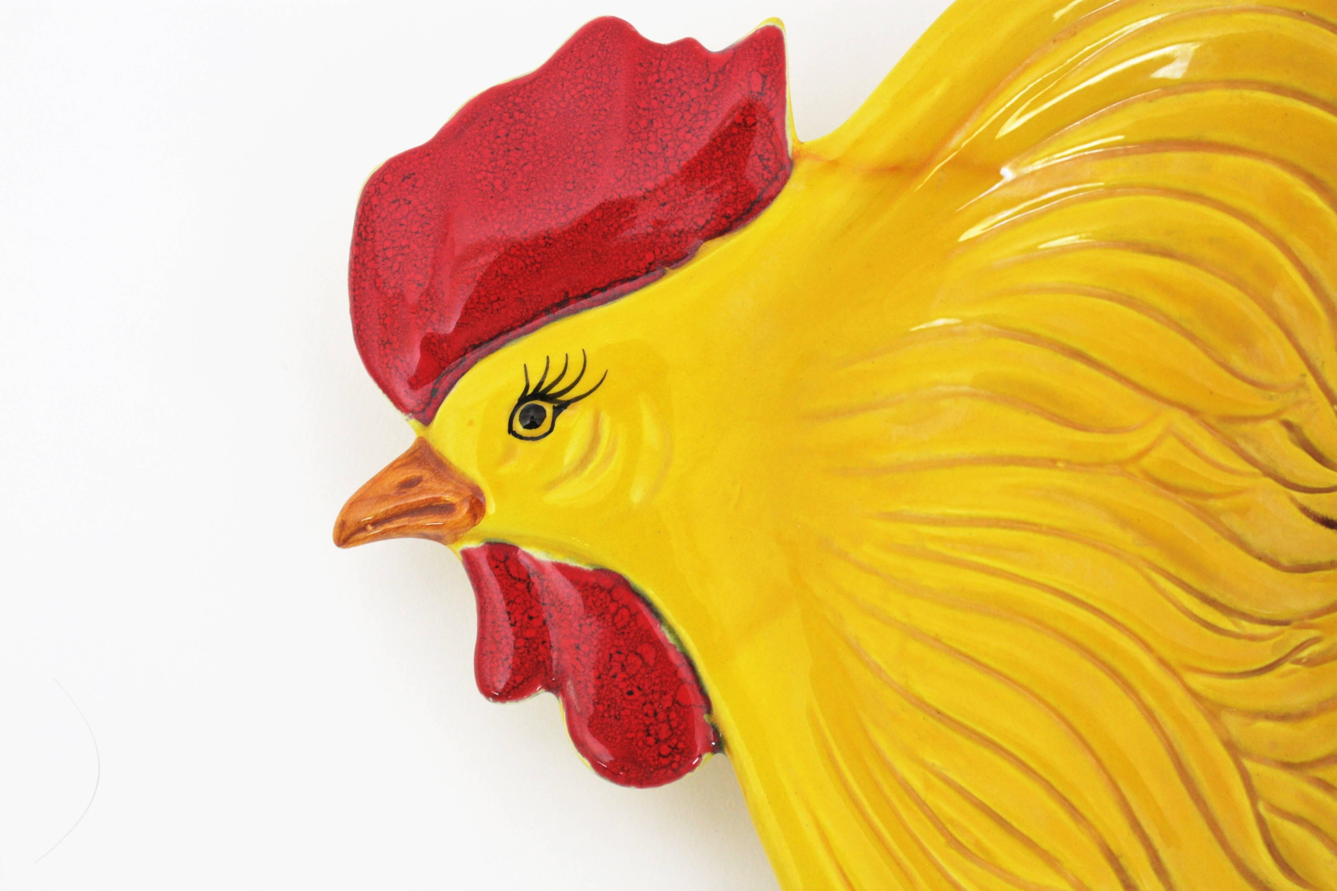 A highly decorative glazed ceramic hen or chicken egg platter or brakfast platter in vibrant yellow color with accents of red and orange. Add a chic style to your table using it as breakfast server, but also it would be heartbreaking placed as a