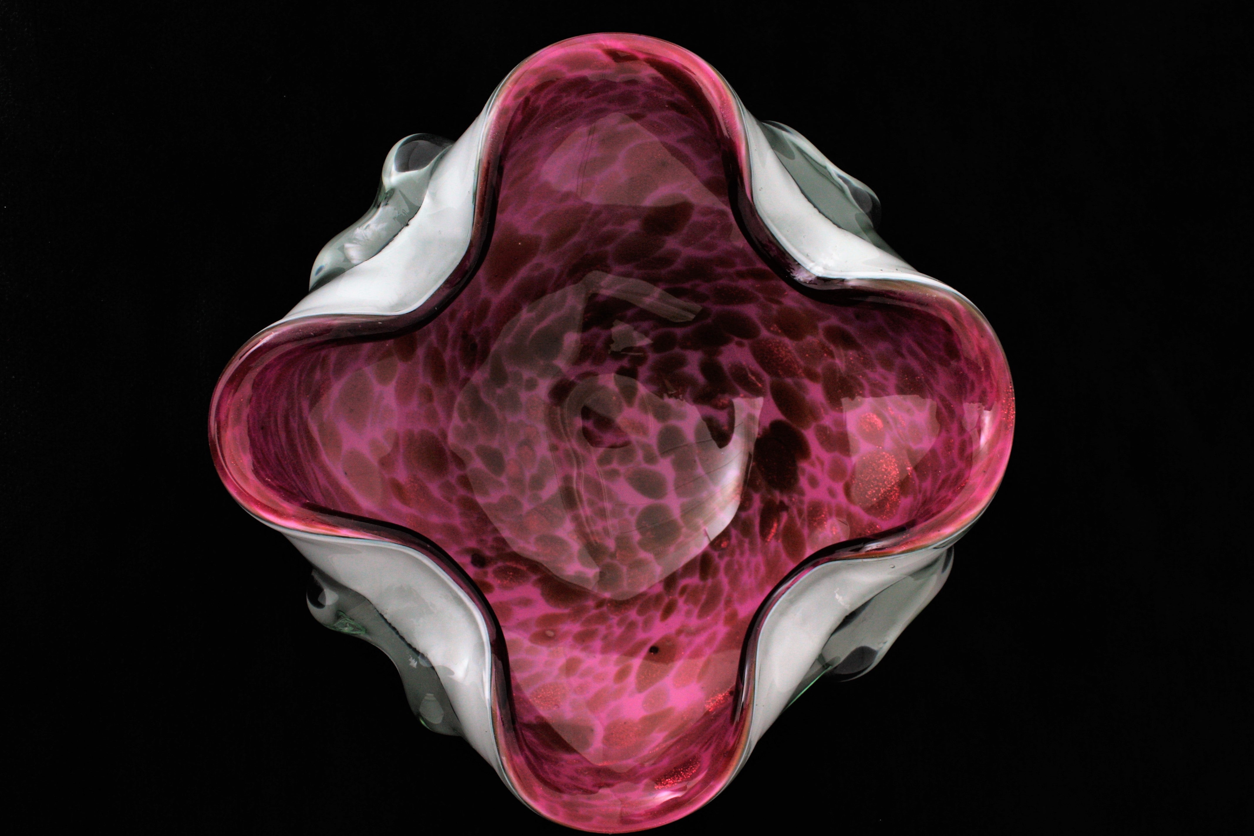 Midcentury Murano Glass Bowl with Aventurine Flecks. Attributed to Fratelli Toso.  Italy, 1950-1960s.
Beautiful handblown pink, purple and white with copper aventurine flecks spotted Italian art glass flower shaped bowl or ashtray. This free-form