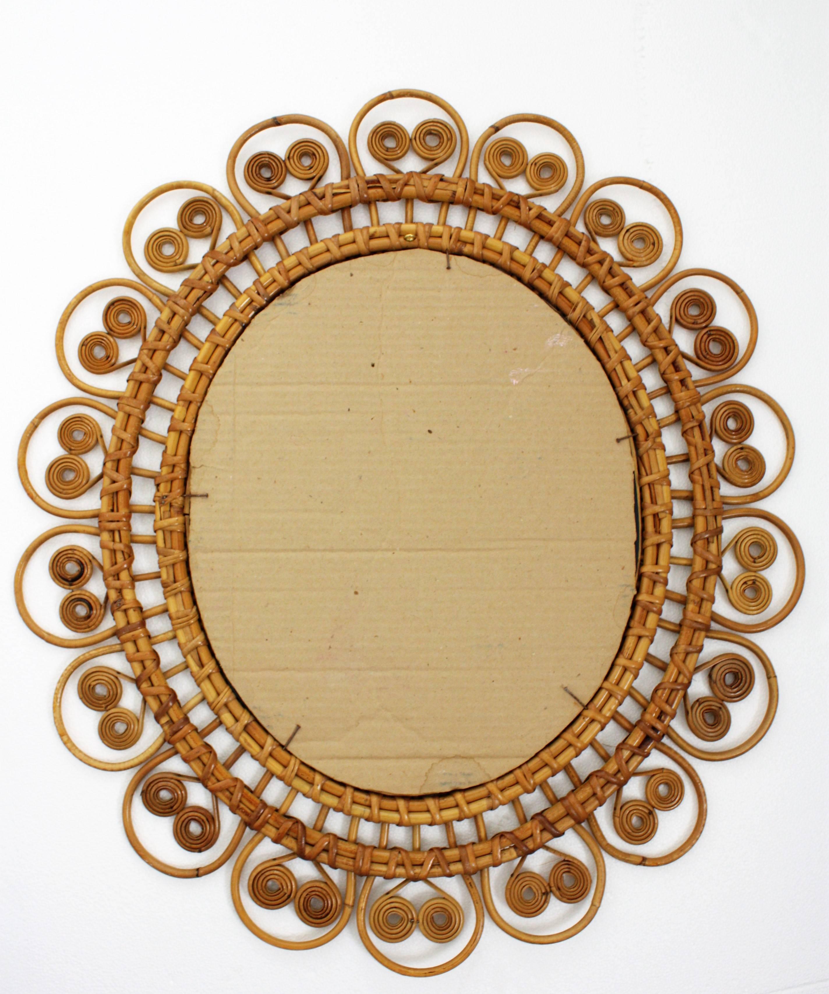Spit Curl Oval Shaped Rattan Wall Sunburst Mirror, France, 1950s In Excellent Condition In Barcelona, ES
