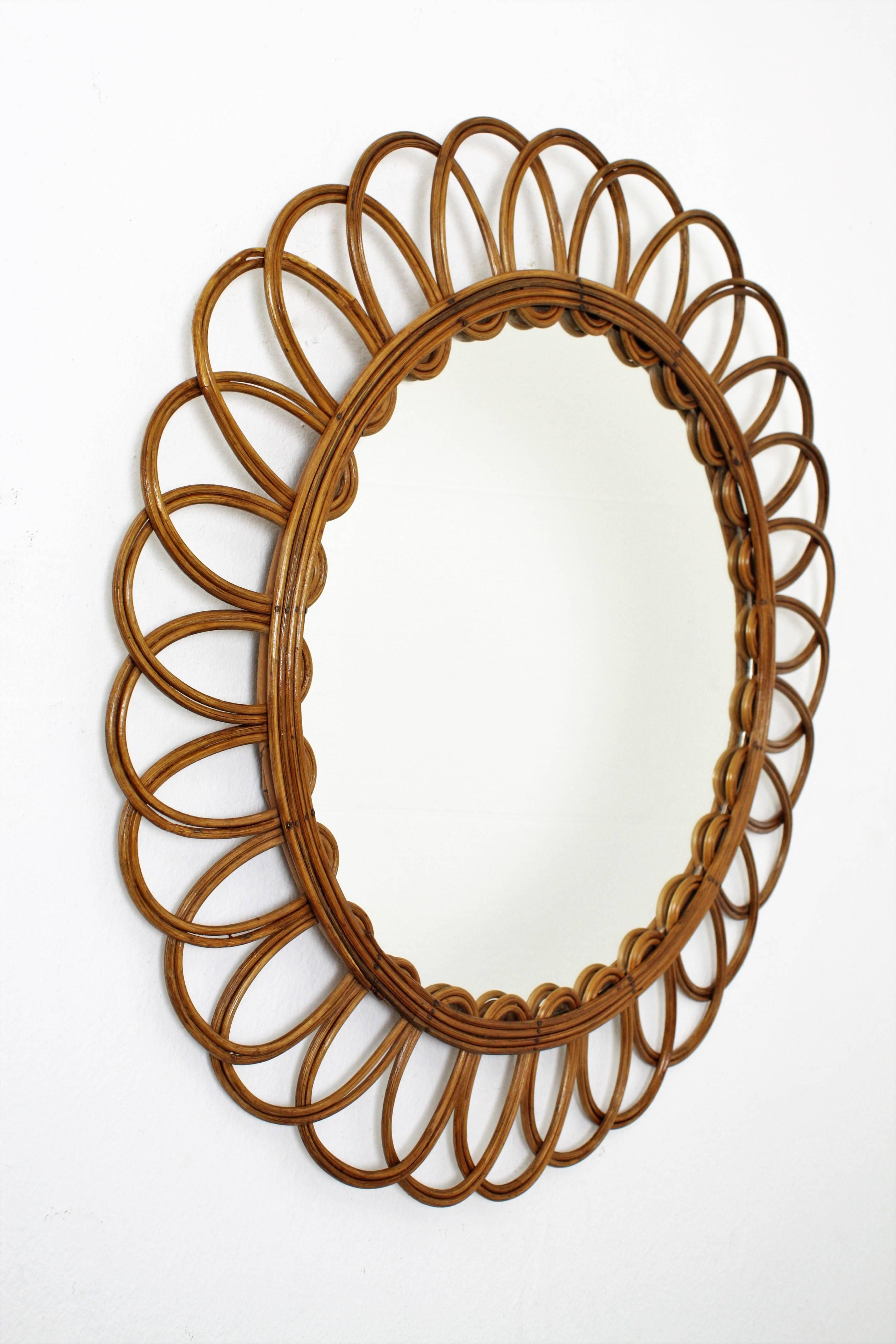 A pretty beautiful flower burst handcrafted rattan mirror manufactured at the 1960s. Lovely to place it alone or creating a wall decoration with other mirrors in this manner.
France, 1960s

Glass dimensions: 39 cm 

   