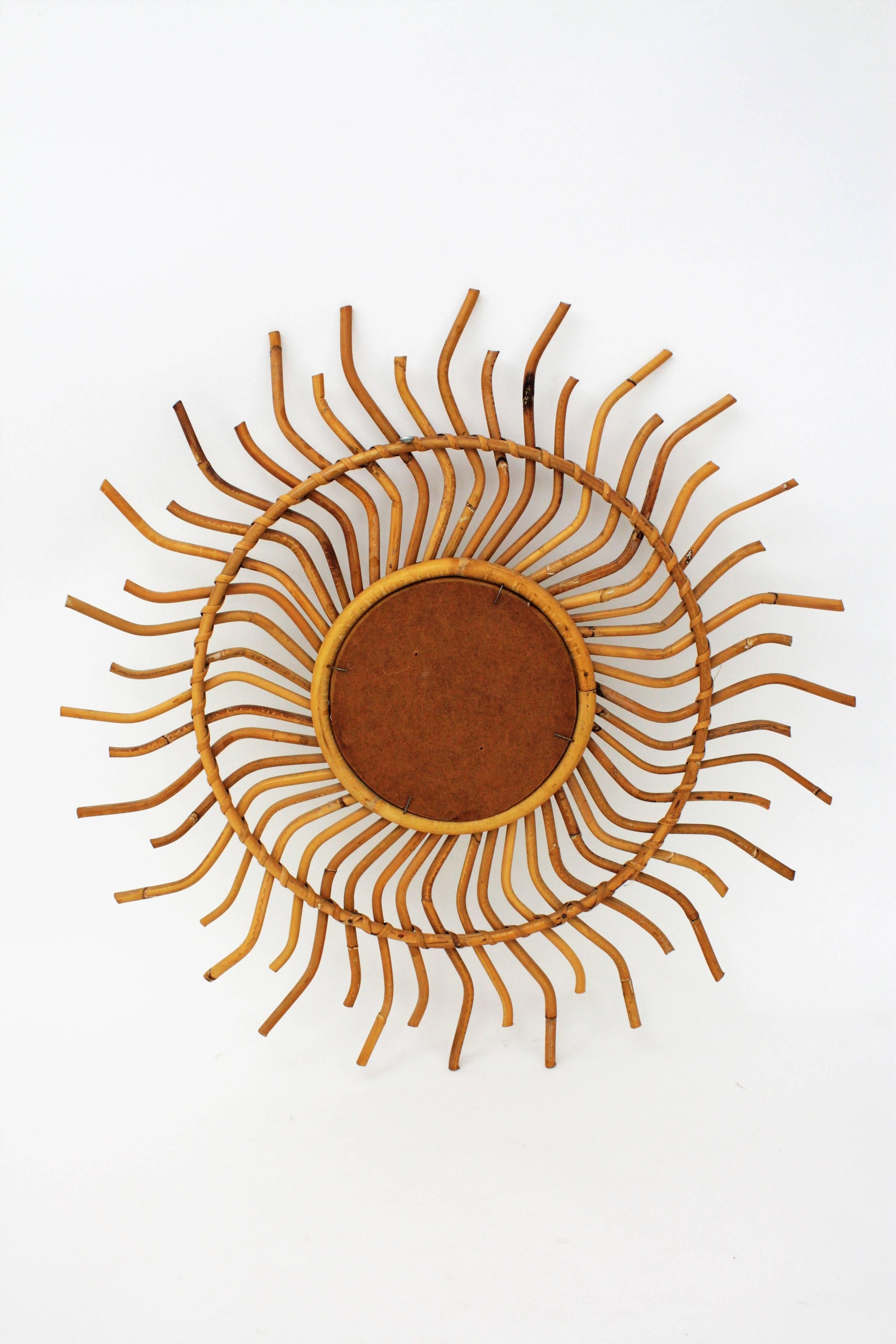 Wicker 1960s Spanish Bamboo Rattan Sunburst Pinwheel Mirror with Curly Beams