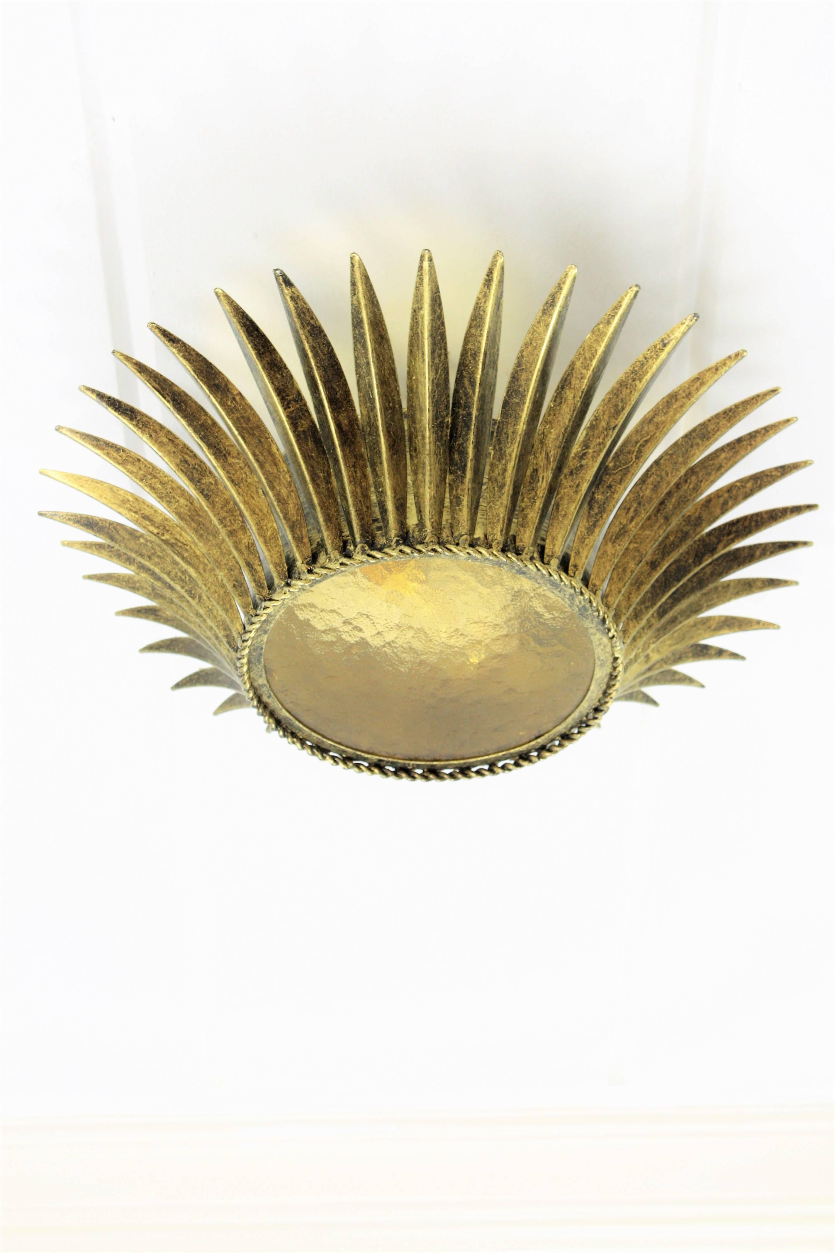 Spanish, 1950s Gilt Iron Sunburst Crown Ceiling Fixture with Amber Glass In Excellent Condition In Barcelona, ES