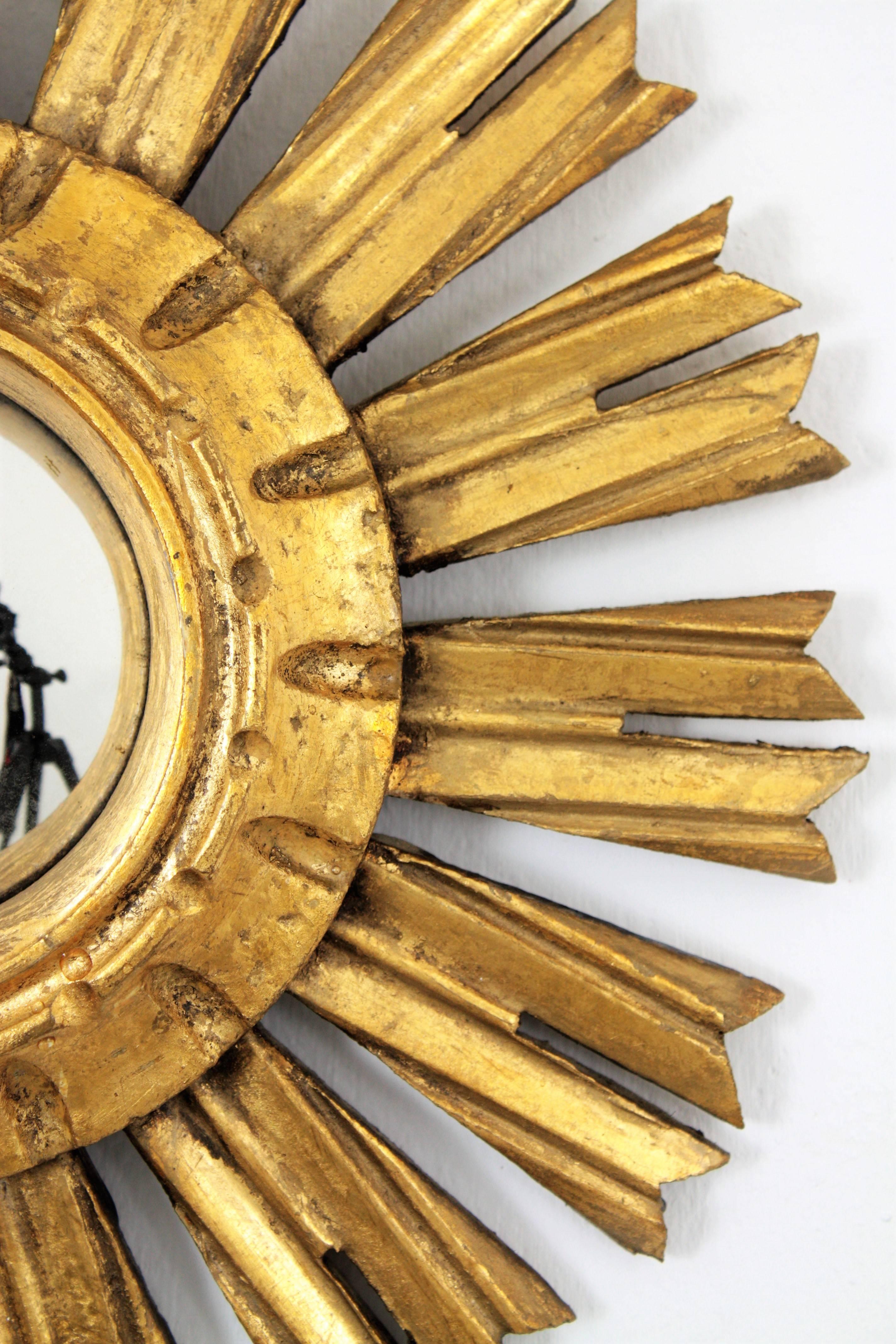 Mid-20th Century Unusual Spanish, 1940s Giltwood Mini Sunburst Convex Mirror in Baroque Style