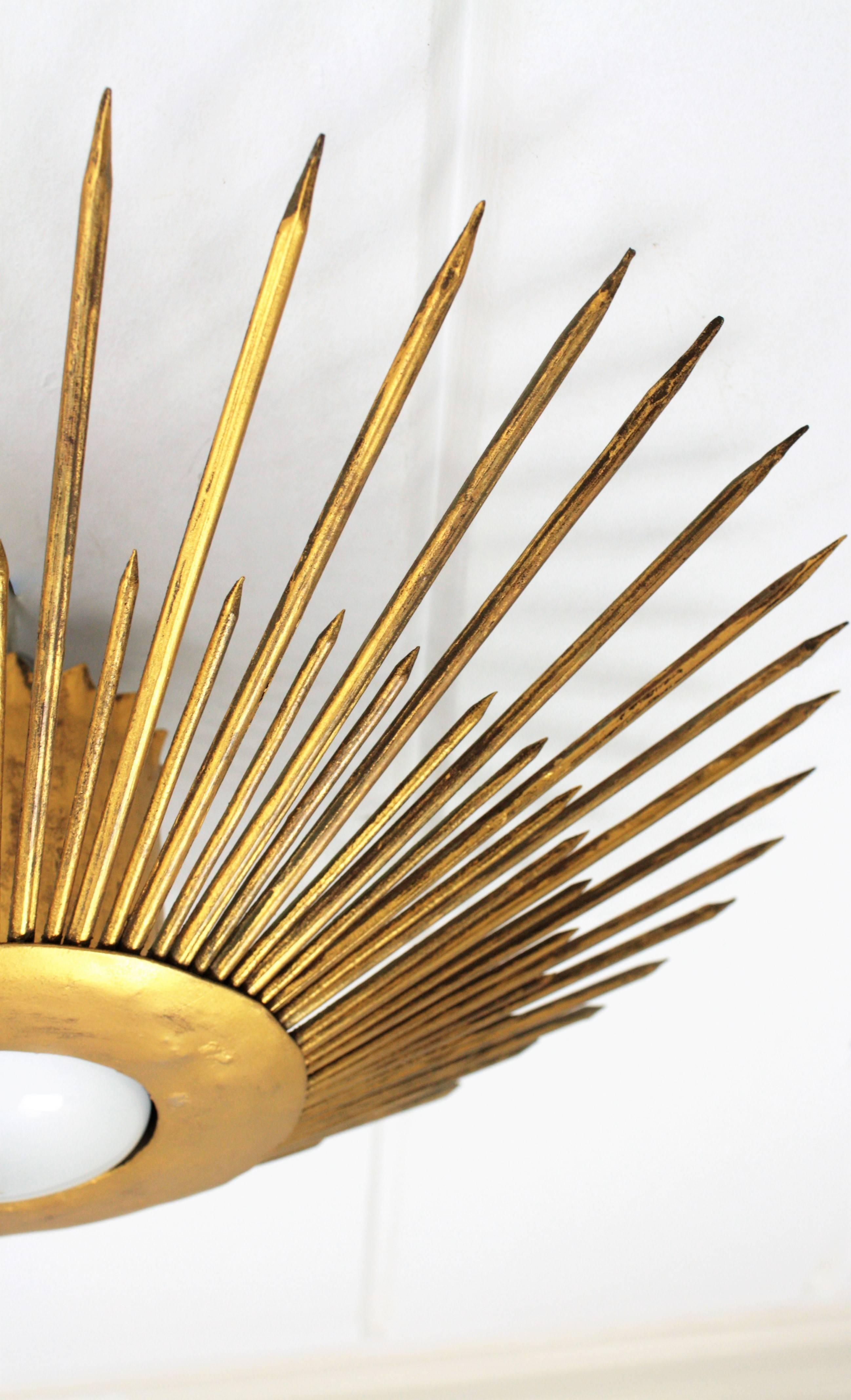 Mid-20th Century Large Wrought Iron Gold Leaf Gilt Sunburst Flush Mount / Pendant, France, 1940s