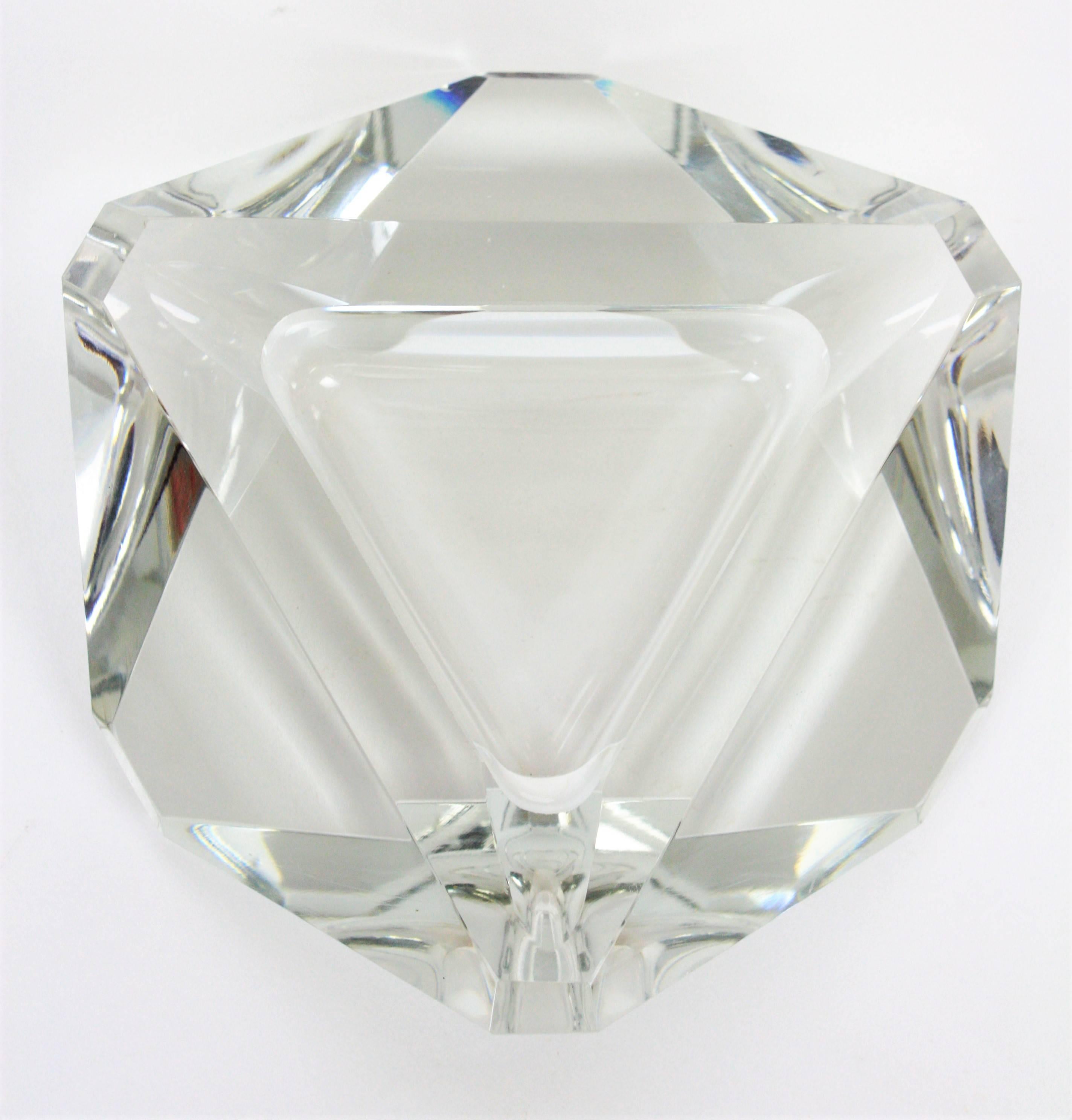 A highly decorative faceted crystal triangular shaped ashtray from the Art Deco period. Attributed to Baccarat. Extra thick crystal clear faceted glass and large size. Excellent condition. Useful as ashtray, vide poche or paperweight.
France,