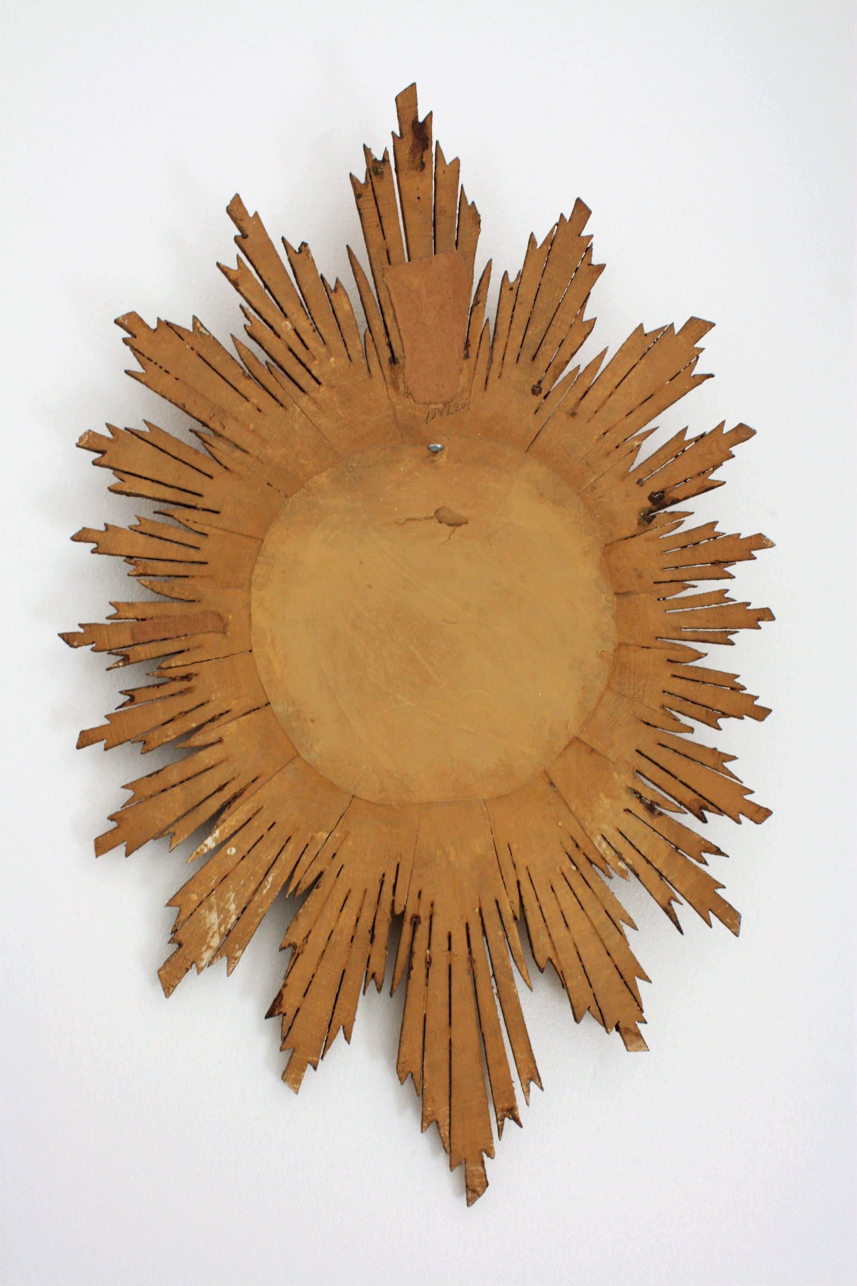 Hollywood Regency Carved Giltwood Oval Sunburst Convex Mirror, Spain 1940s 2