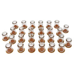 Collection of 27 Clear Glass Creamers with Maple City Dairy Caps