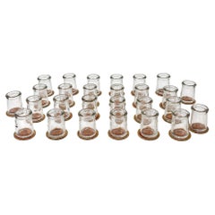 Collection of 27 Clear Glass Creamers with Maple City Dairy Caps