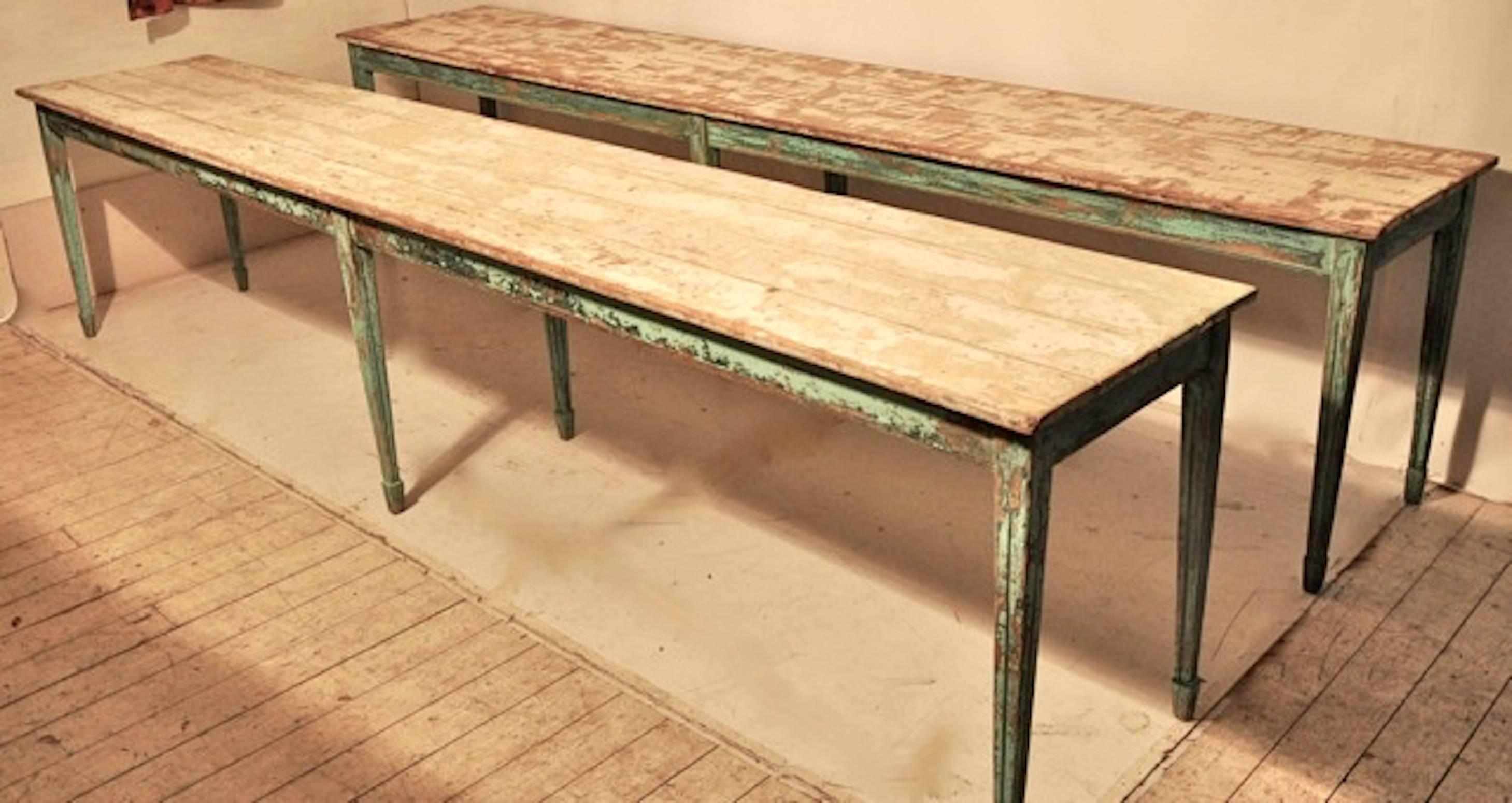 So rare to find a pair of long country tables! The table bases retain their original paint in a fantastic turquoise blue/green color. The tops are scraped to reveal colors of white and green. Both tables have been scraped and sealed so the tops are