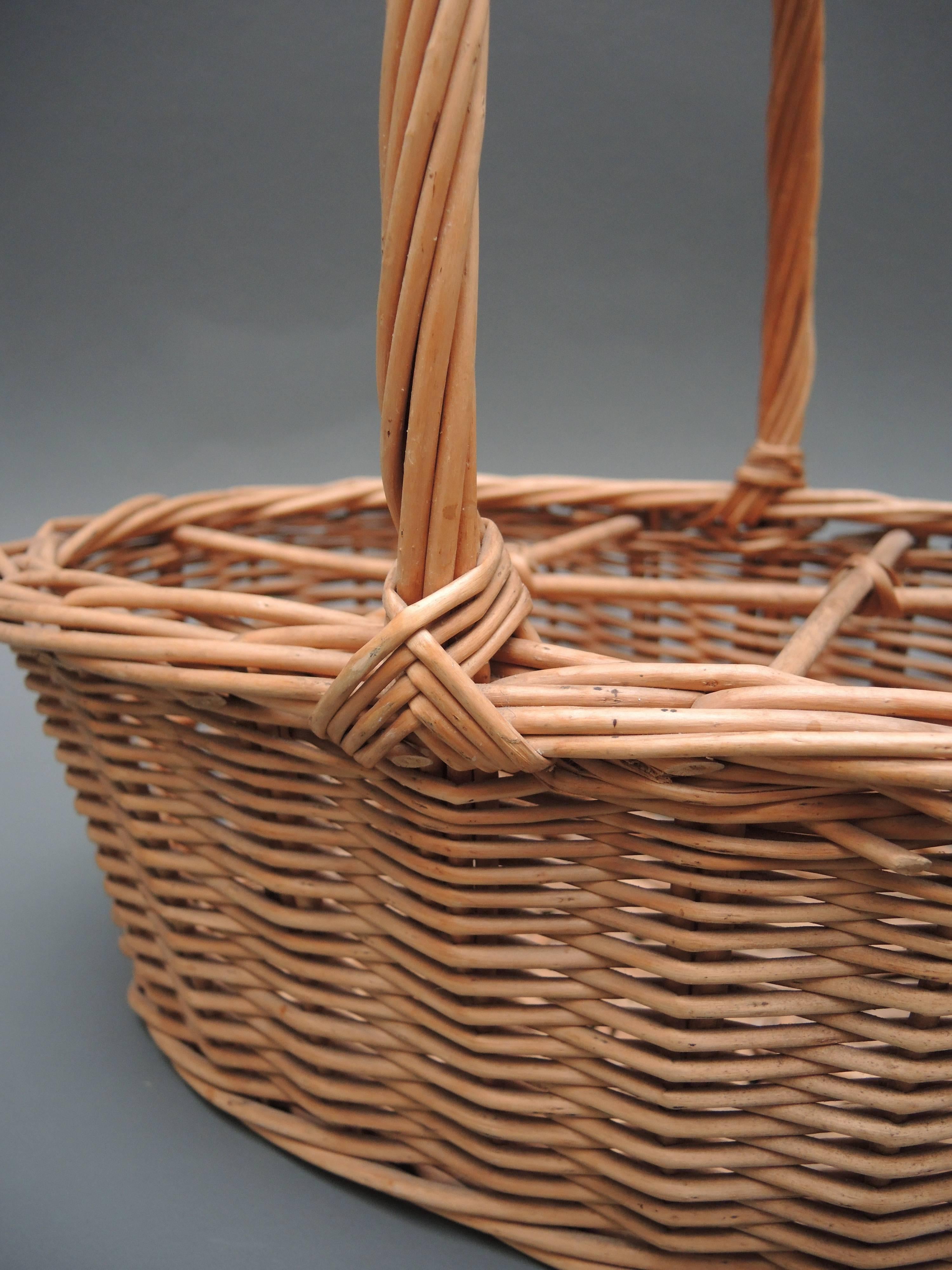 French wicker market basket to carry wine bottles, circa 1920.
Great to use to hold wine, napkins or magazines!