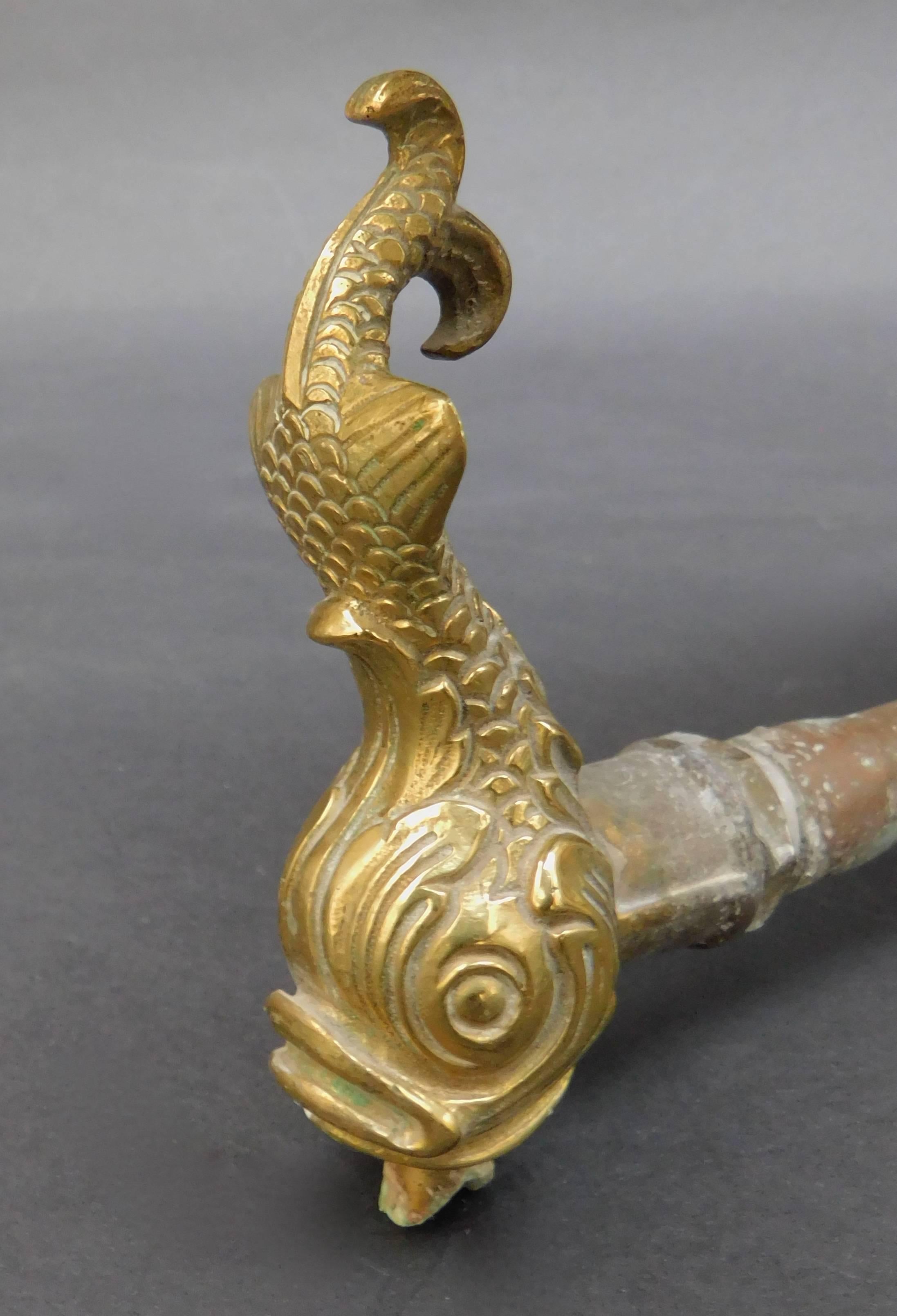 This antique French cast brass fountain spout has a stylized dolphin motif to be used in a grotto setting.
Measurement of the depth is to where the copper pipe connects to the brass, and not the full depth with copper pipe.