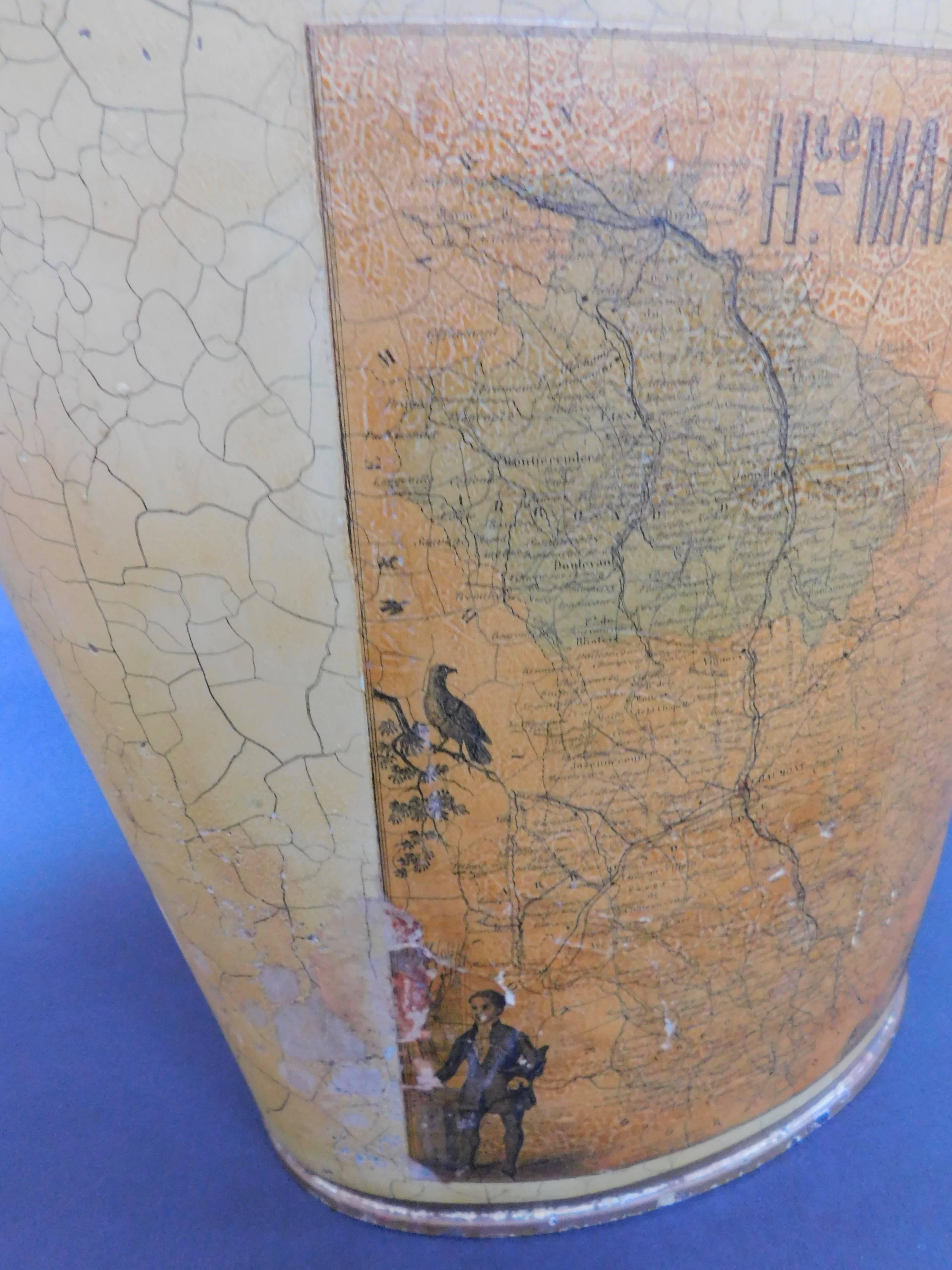 1950s French tole waste paper basket or trash can with a decoupage applied map highlighting the area of the Haute Marne. Original crackle paint in a very light golden yellow with a robin's egg blue interior. A perfect accessory for the library, den