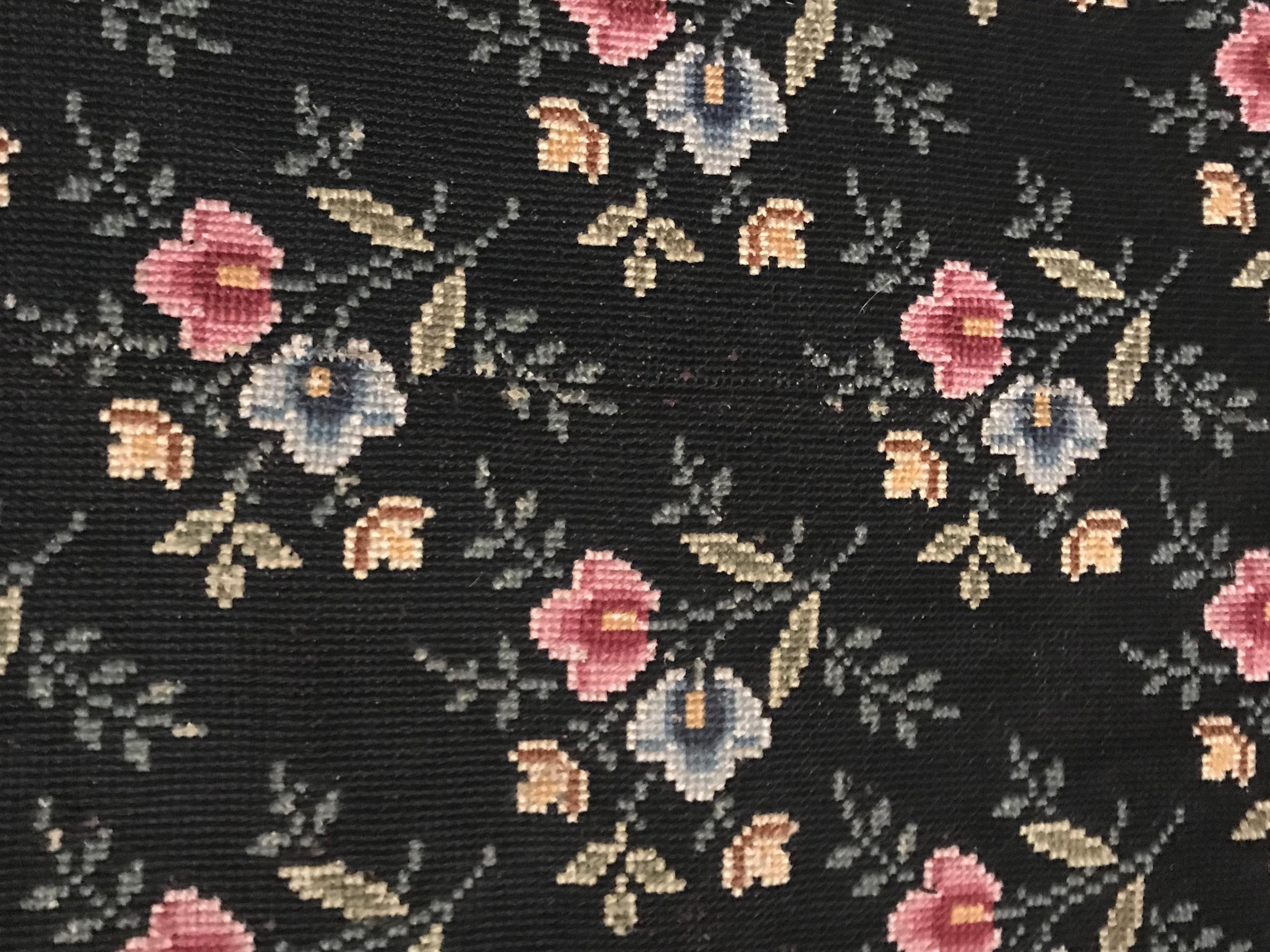 19th century black French carpet. Hand cross stitched wool needle work on linen ground. Coming from a grand estate that stated the carpet was purchased from the St.-Germain-des- Pres antique shop of the French Decorator Madeleine Castaing in the