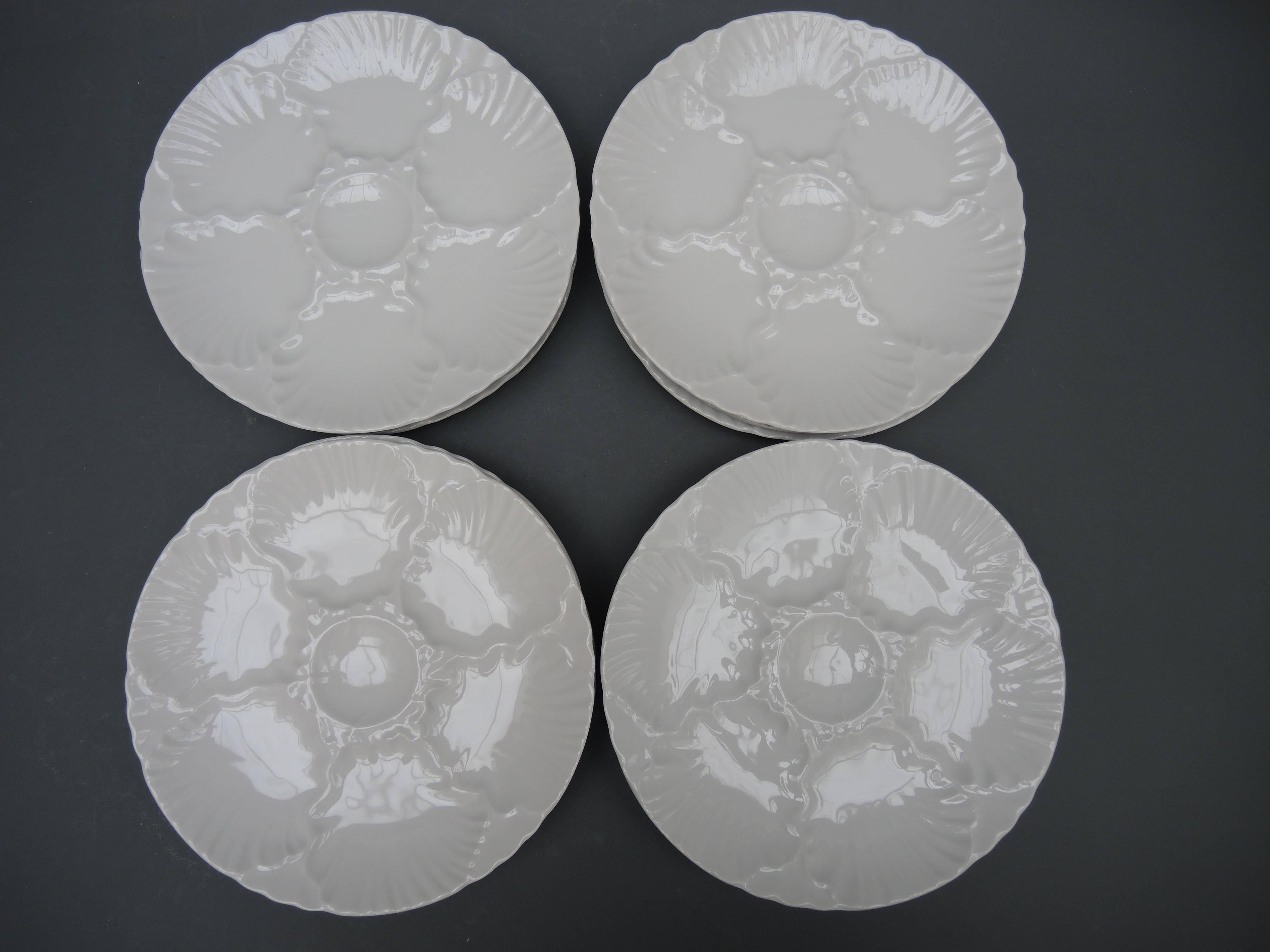 A set of twelve white oyster plates made in the 1970s by the German porcelain company of Waldsassen Bareuther. All the plates are identical and in excellent condition.