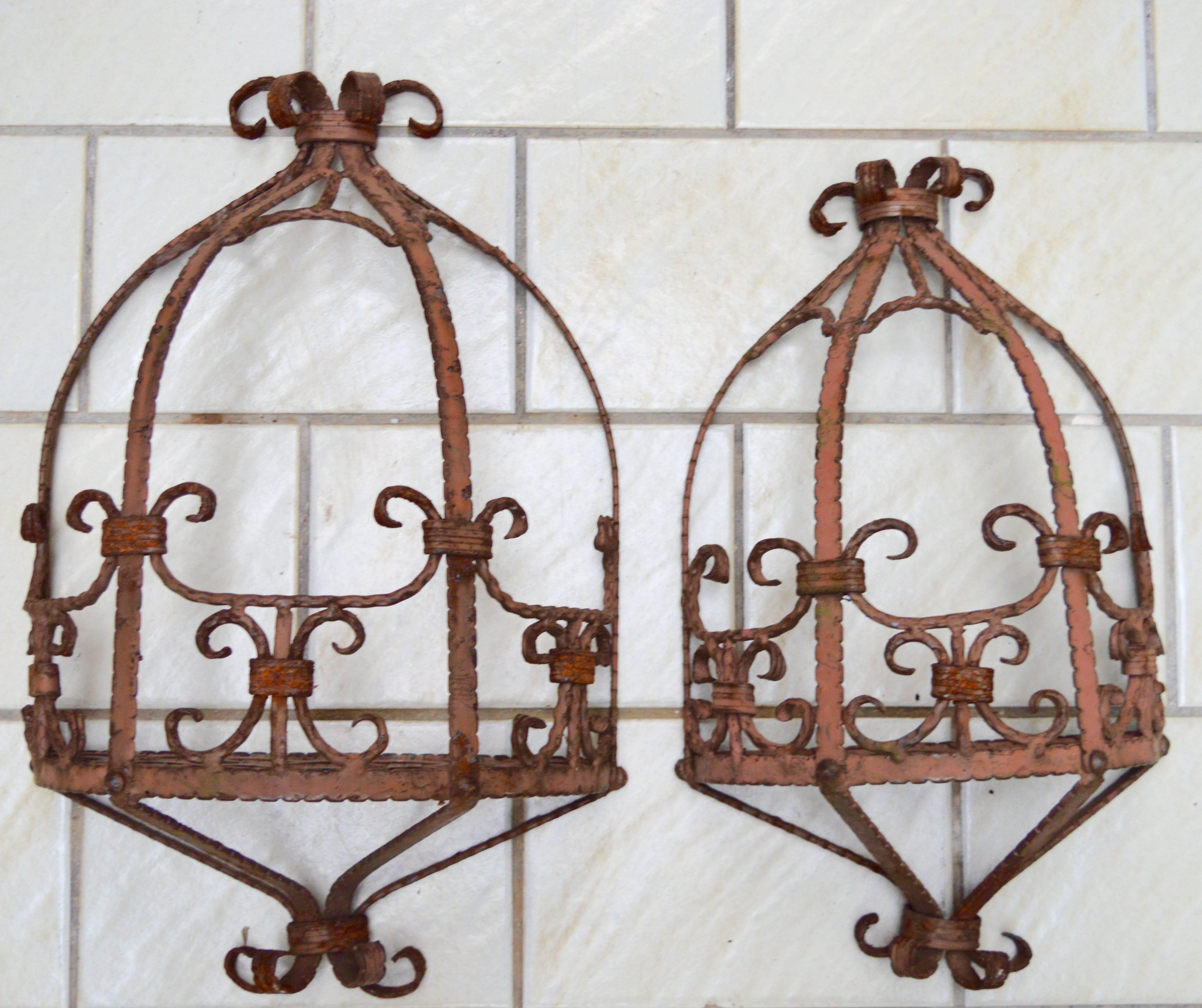 Italian hand wrought iron and woven steel shelves made to hold potted plants on a garden wall. Venetian circa 1940 , retaining the original paint.

The sizes are listed here because the listing form doesn't allow for multiple measurements.
44 H x