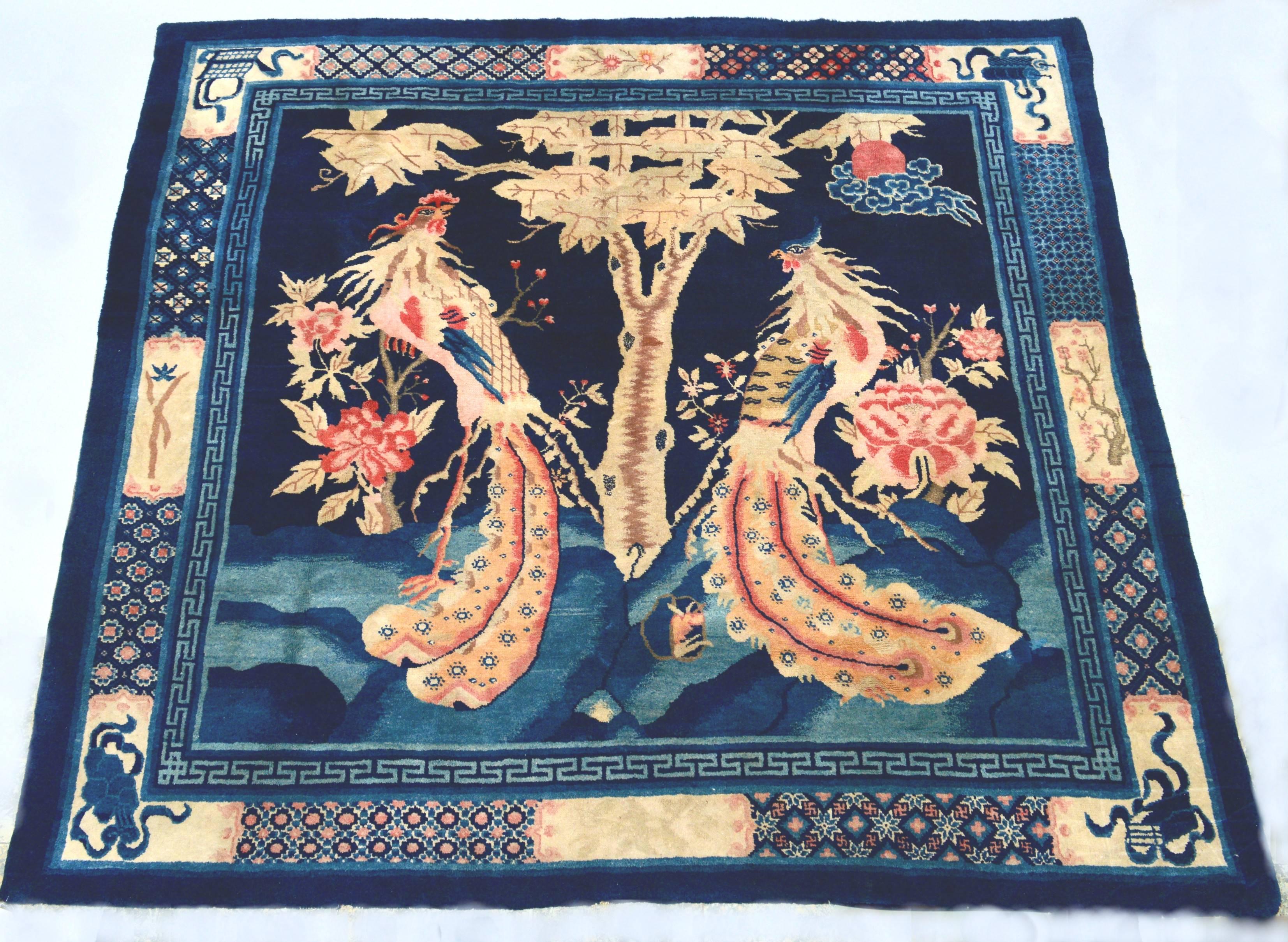 Antique Peking ceremonial phoenix carpet. A ceremonial carpet would be laid out in a receiving room .The carpet would be placed on the floor in front of chairs where the owner would receive an important visitor or member of court. 
The male and