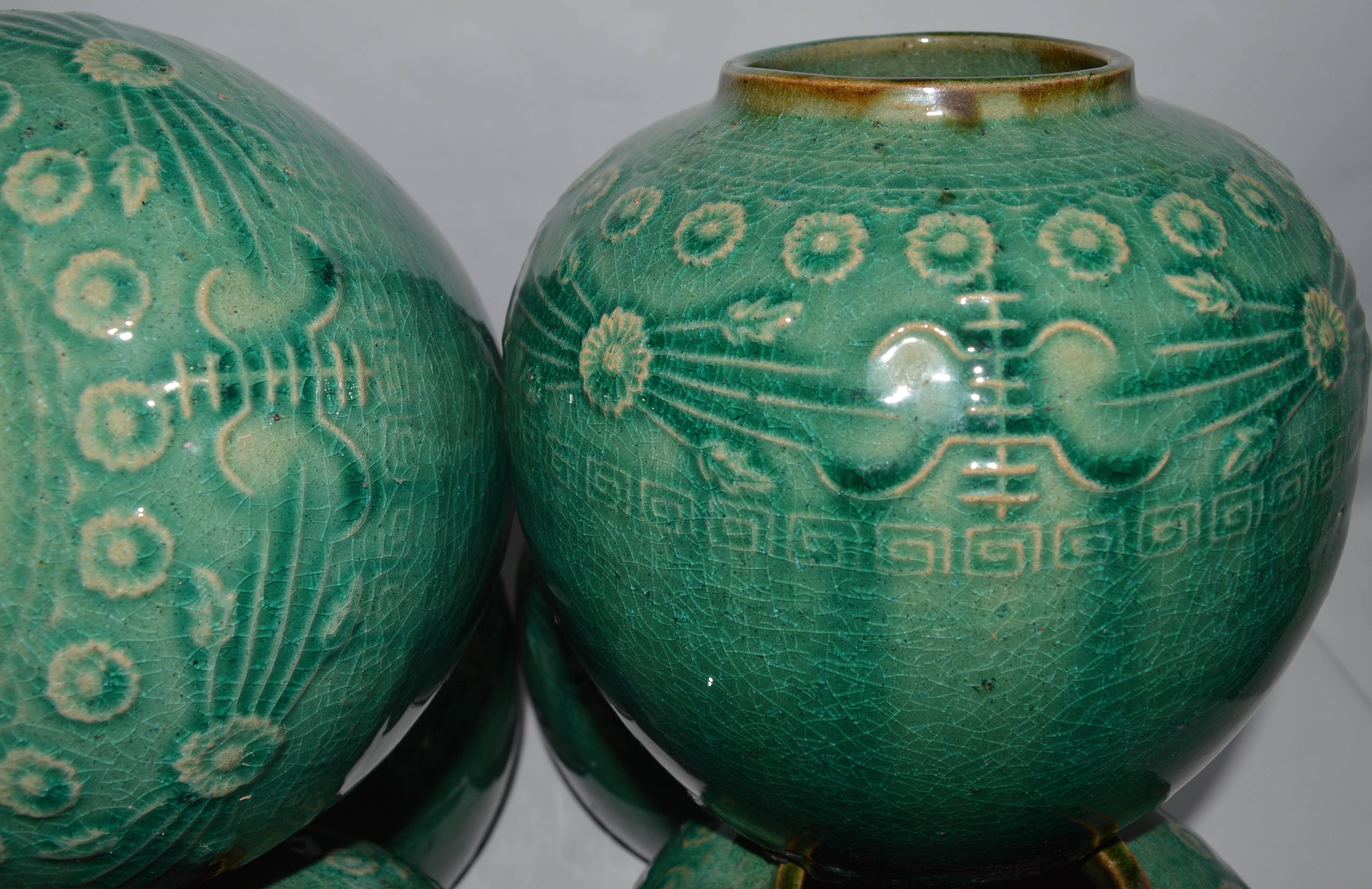 Late 19th century Chinese merchants ginger jar. Jars of this sort were used to pack and store ginger by merchants. Raised decoration on clay body glazed in the most beautiful jade green color.  good condition with no chips or breaks. 