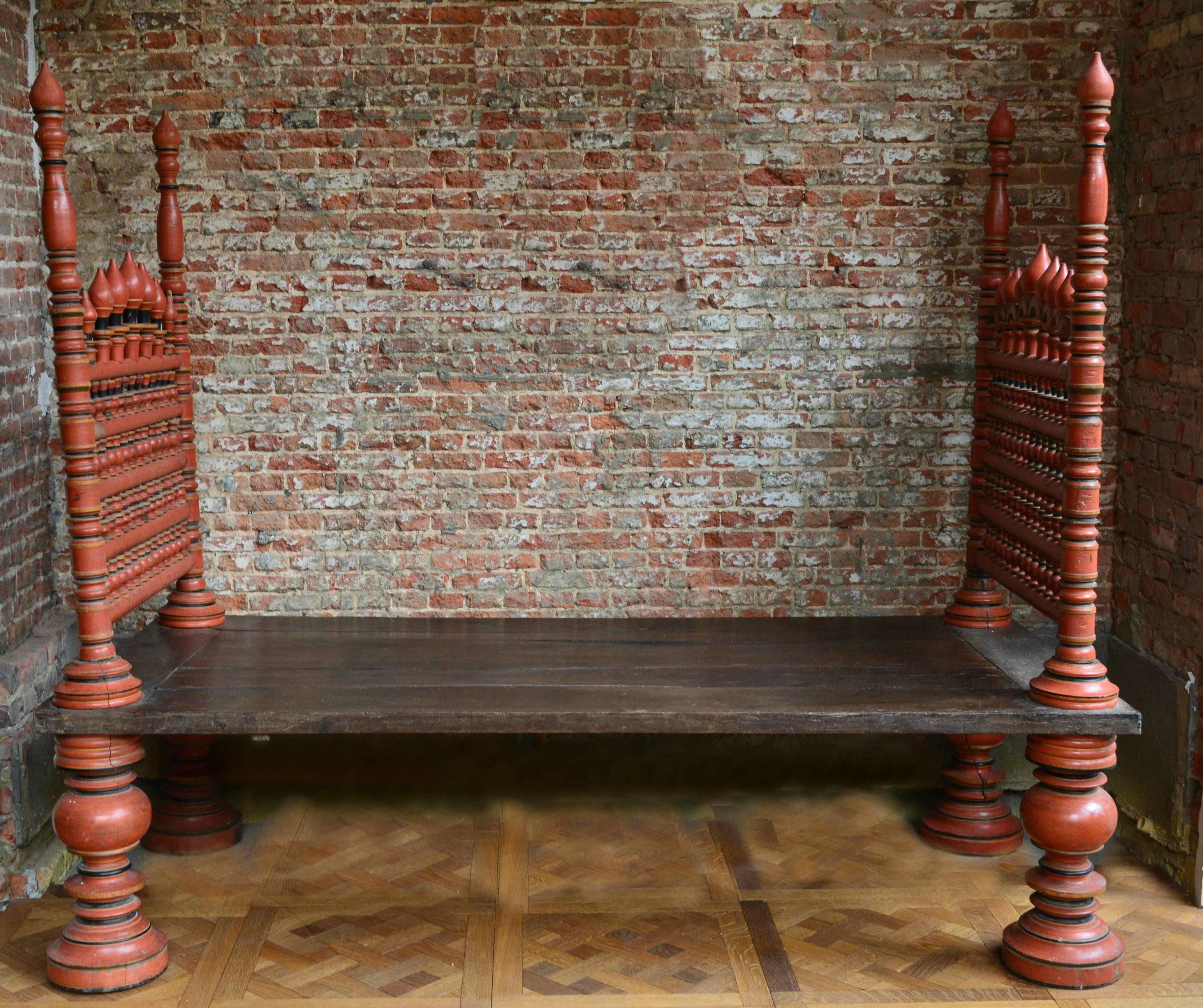 Beautiful 19th century Maharaja bed for lounging with removable sides. Completely original including the paint and the solid jack wood surface. The sculptural legs are each hand turned from a solid tree trunk!
There is a down filled velvet cushion