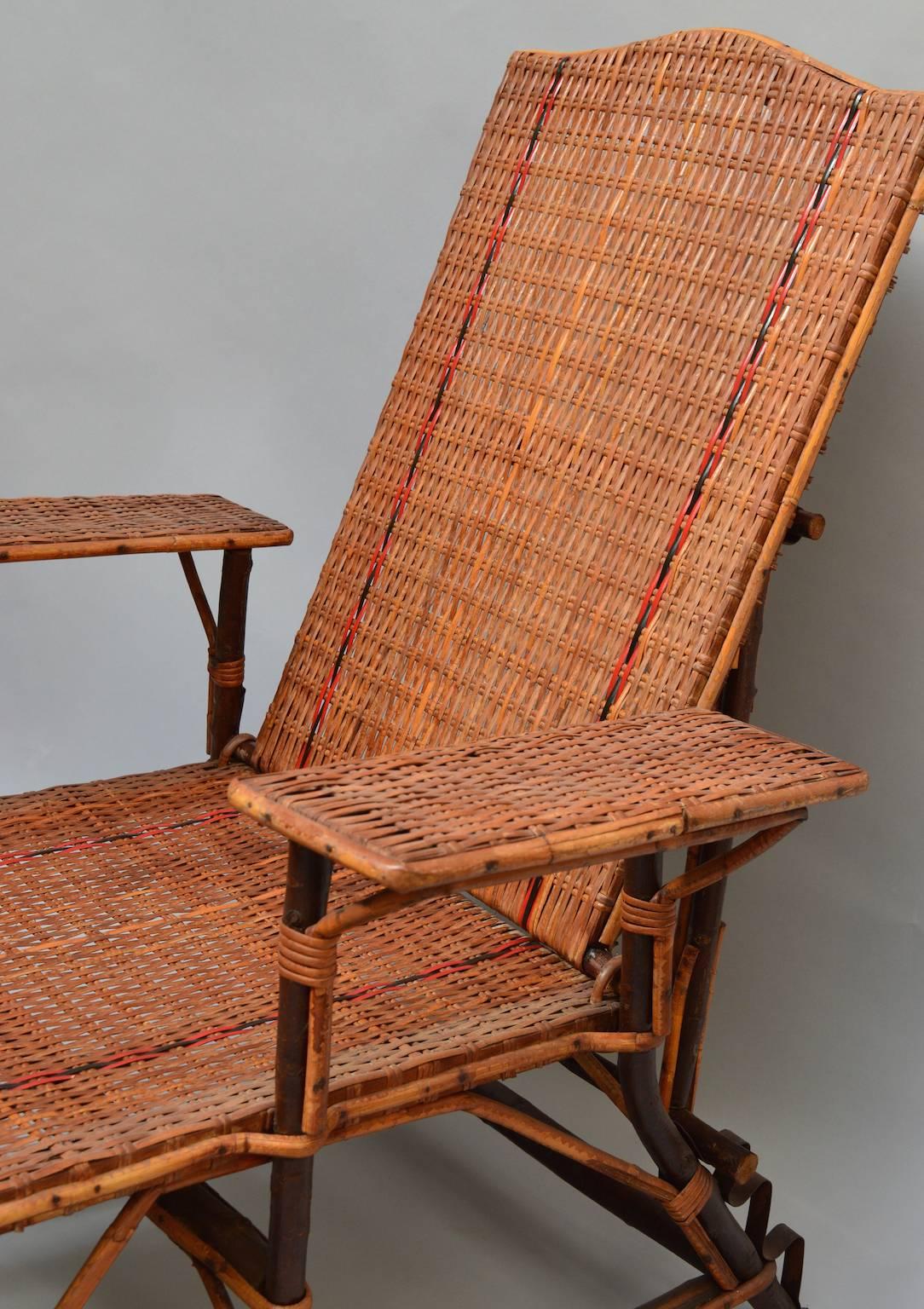 A vintage French woven rattan lounge chair with detachable footrest and adjustable back. The frame is made from twigs with smooth bark which lends special one of a kind character only found in a handmade piece.
Perfect to relax and read a book just
