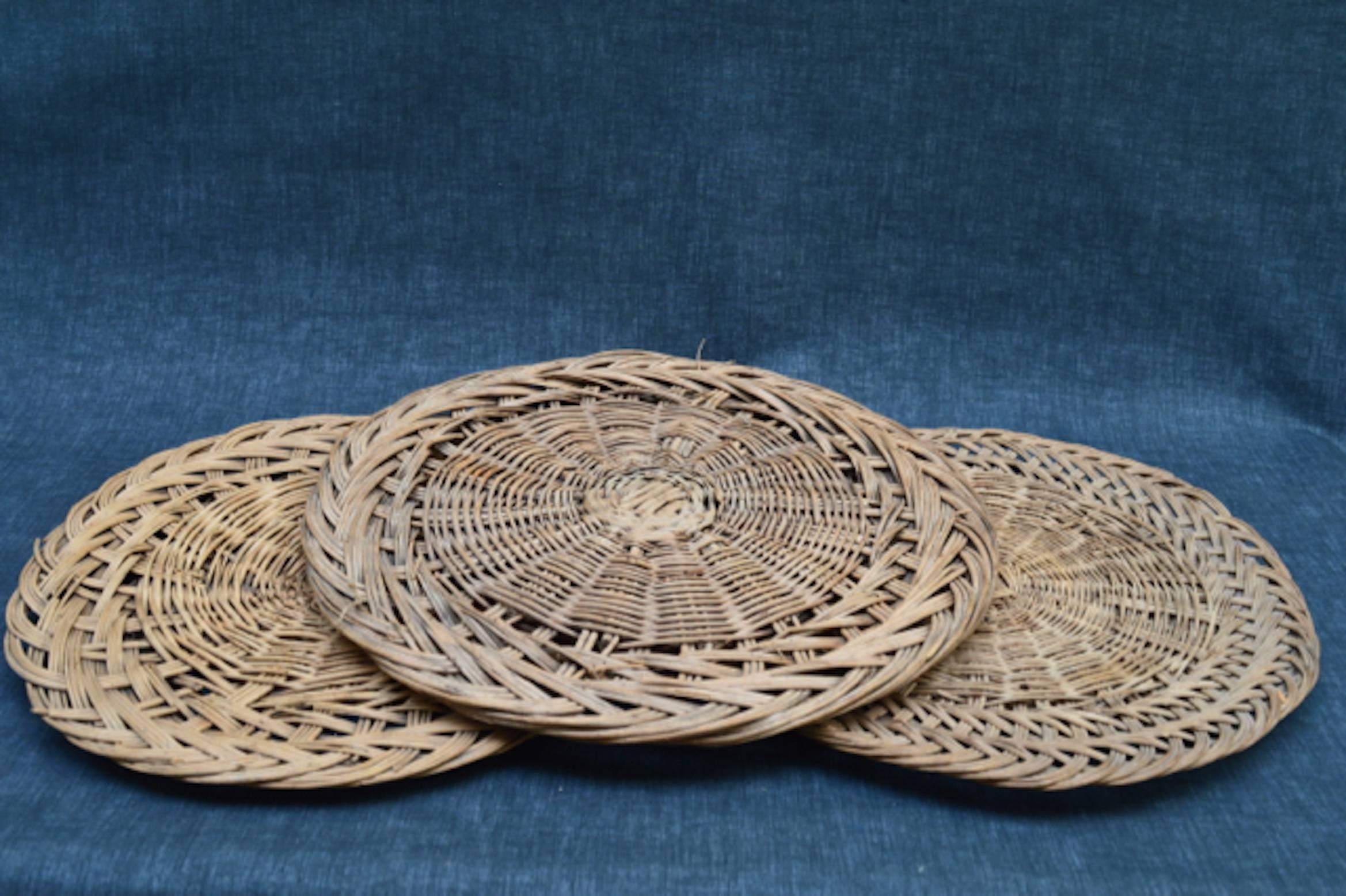 A group of three French woven wicker stands used in Provence patisserie shops and markets to display tarts and quiches, circa 1910.
Great to use for entertaining or hung on the wall for decoration.
Largest=45 cm wide. 
Smallest=39 cm wide.