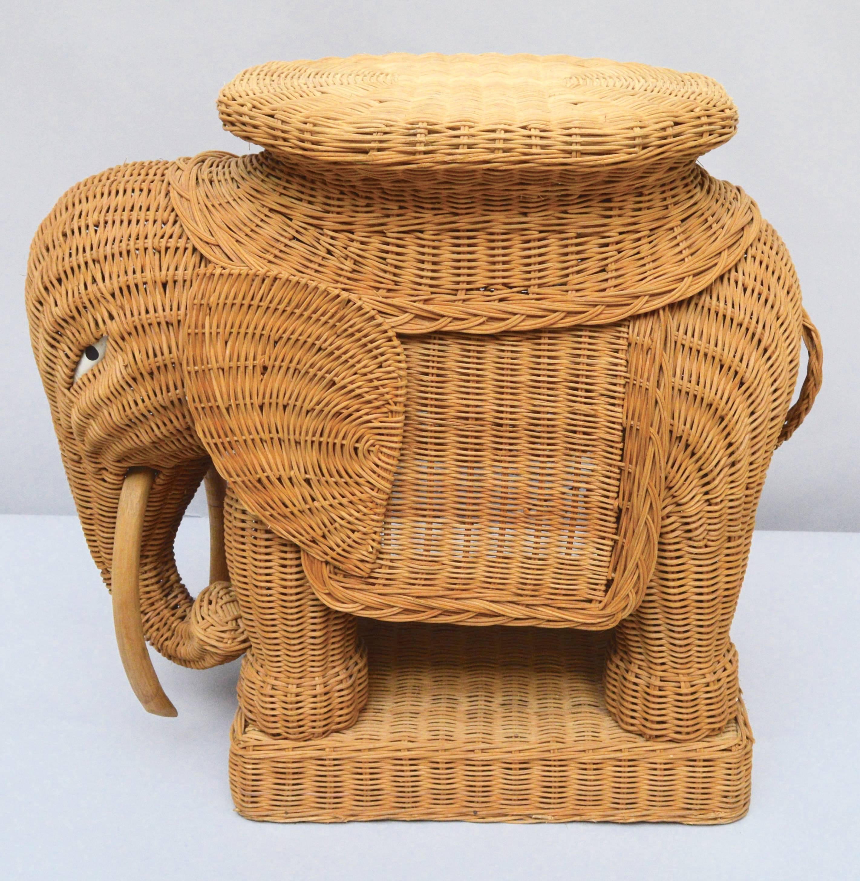 1970s woven wicker elephant made in Italy to be used as either a side table or stool. The tusks are bent bamboo and the eyes are painted wood. A fun addition to any decor.