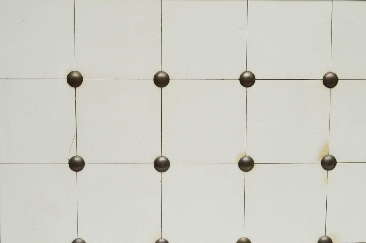 An unusual Belgian pewter and ceramic tile backsplash that is completely framed and made to hang on the wall using two hooks. Interesting in a kitchen or in a bathroom and easily used with existing fixtures.