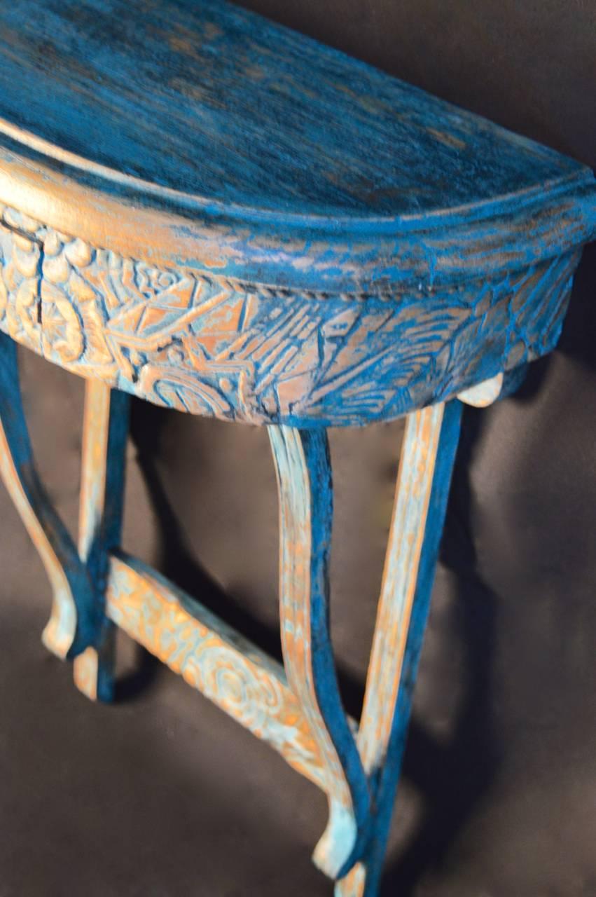 Fantastically chic carved and painted wall mounted console table. 
 The Art Deco design is carved after construction so that the carving continues over the front apron enveloping the drawer. Perfect size for a small entrance hall or in a powder
