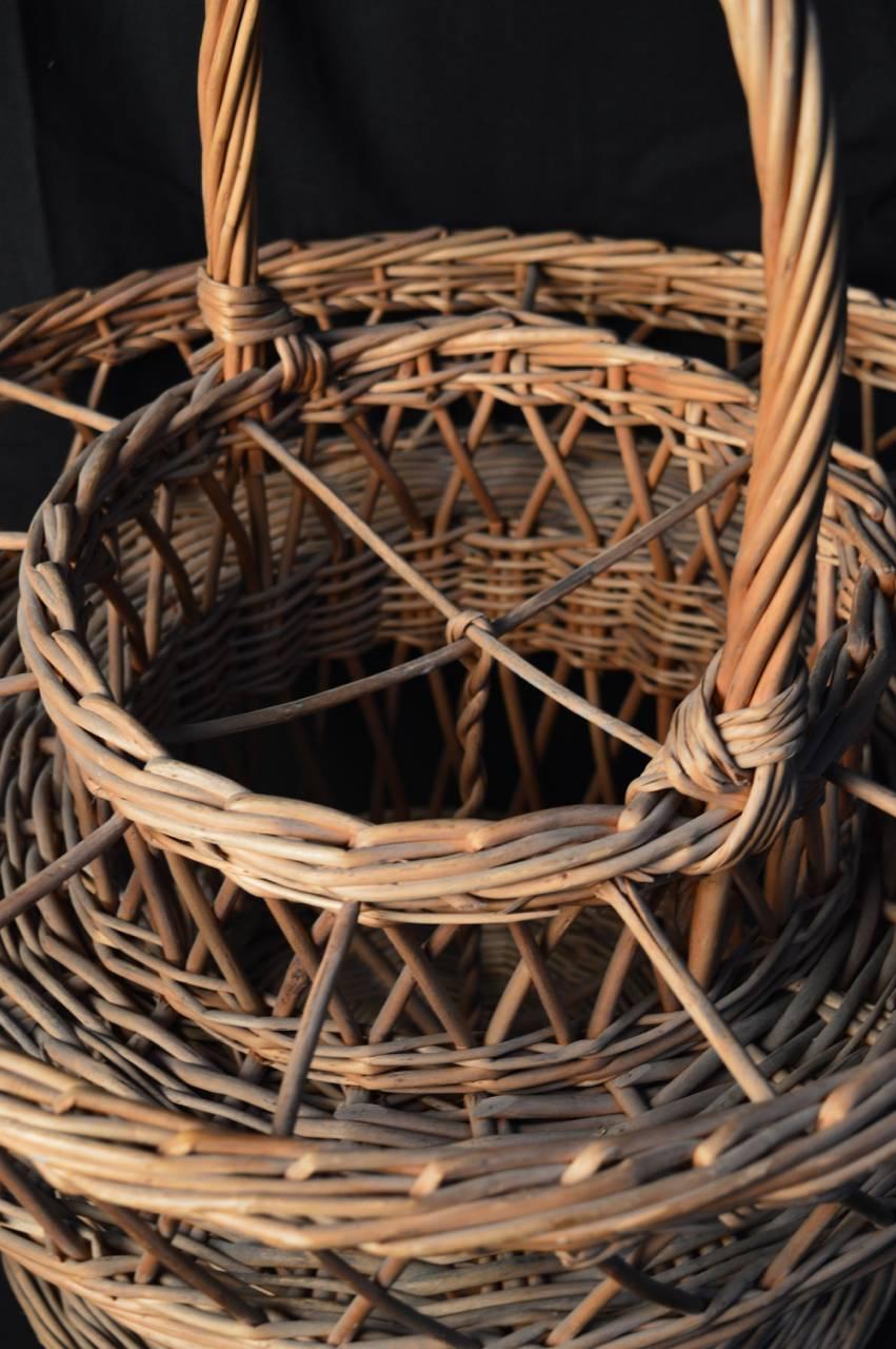 A French woven basket to hold glasses and wine bottles. Used for garden entertaining and picnics.