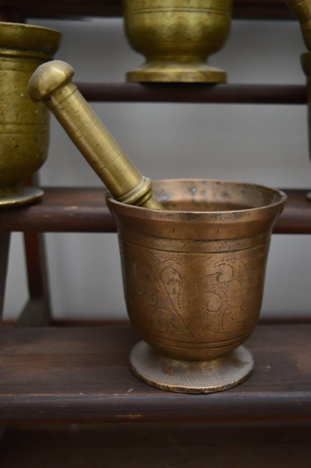 Extremely decorative  bronze mortar and pestles made in the Flanders region in the 17th and 18th Centuries.
The largest mortar is 16 cm high and weighs 4.50 kg(with pestle).
The smallest is 12 cm high and 2 kg.
Priced individually, please specify
