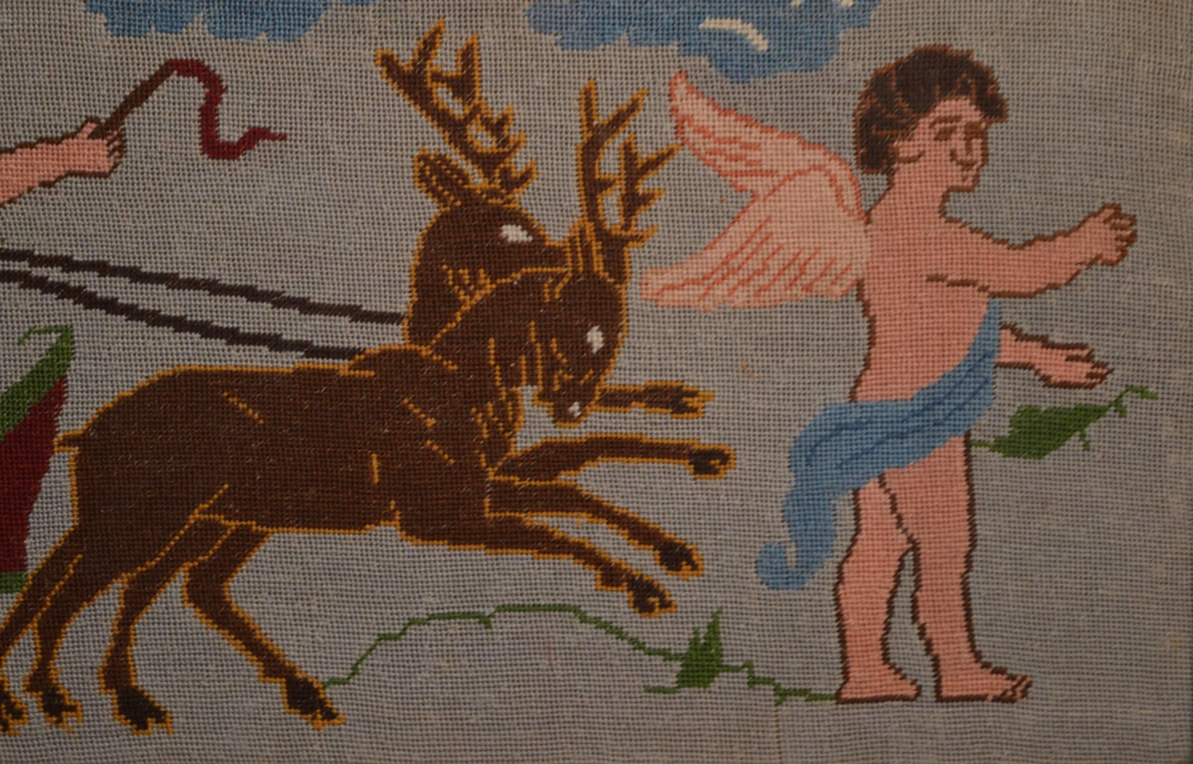 A whimsical and unusual Swedish hand done needlepoint panel showing cherubs with a chariot pulled by deer, circa 1940.
Retaining the original gold and brown wood frame. Fantastic holiday decoration or hostess gift!!
