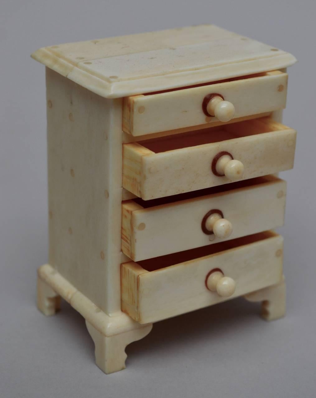 Rare Anglo-Indian miniature carved bone chest of drawers. Beautifully constructed by the artisans of Vizagapatam with tiny bone pegs and working drawers. Circa 1890-1900