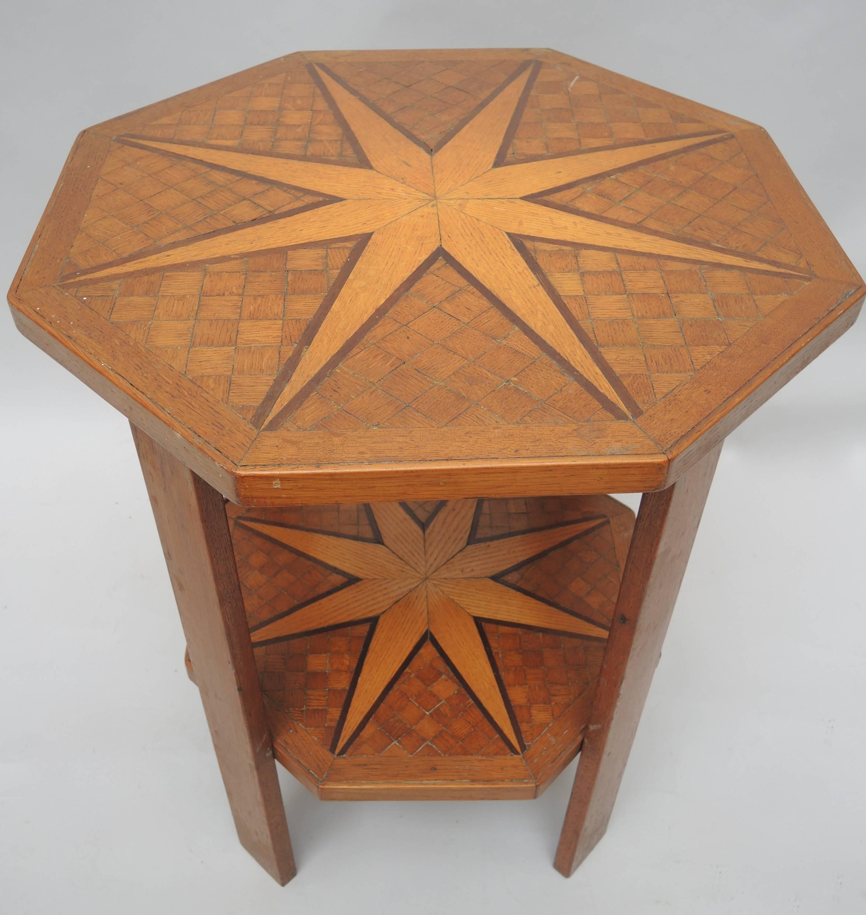 Belgian 1940's side table is constructed of oak and inlaid with parquetry squares and two large Nautical Stars. It came from the main office of the 