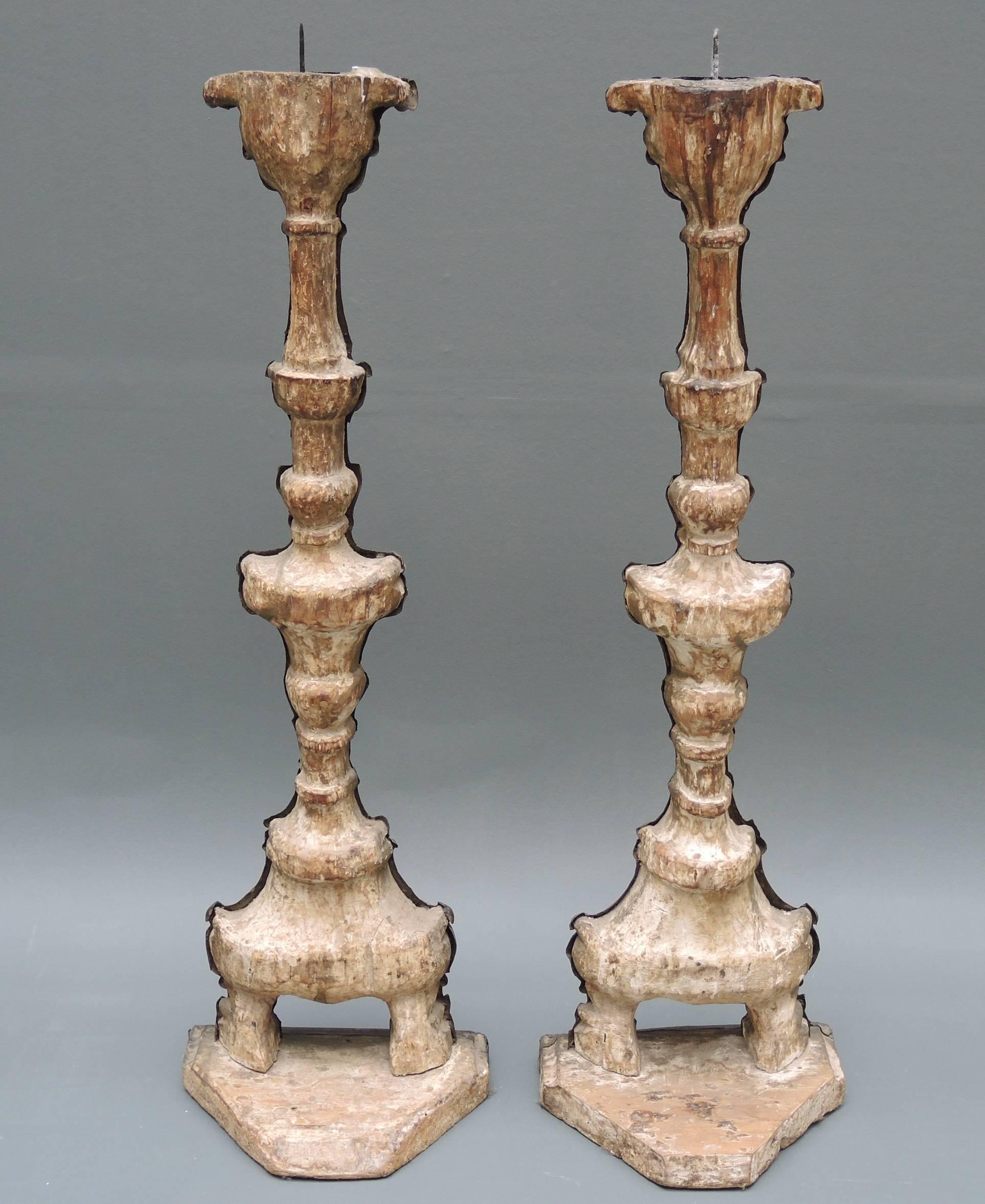 A pair of 18th century Italian altar candlesticks with repoussé brass work over wood. They can be made into table lamps by request at no extra charge.
Repoussé is a metalworking technique in which a malleable metal is ornamented or shaped by