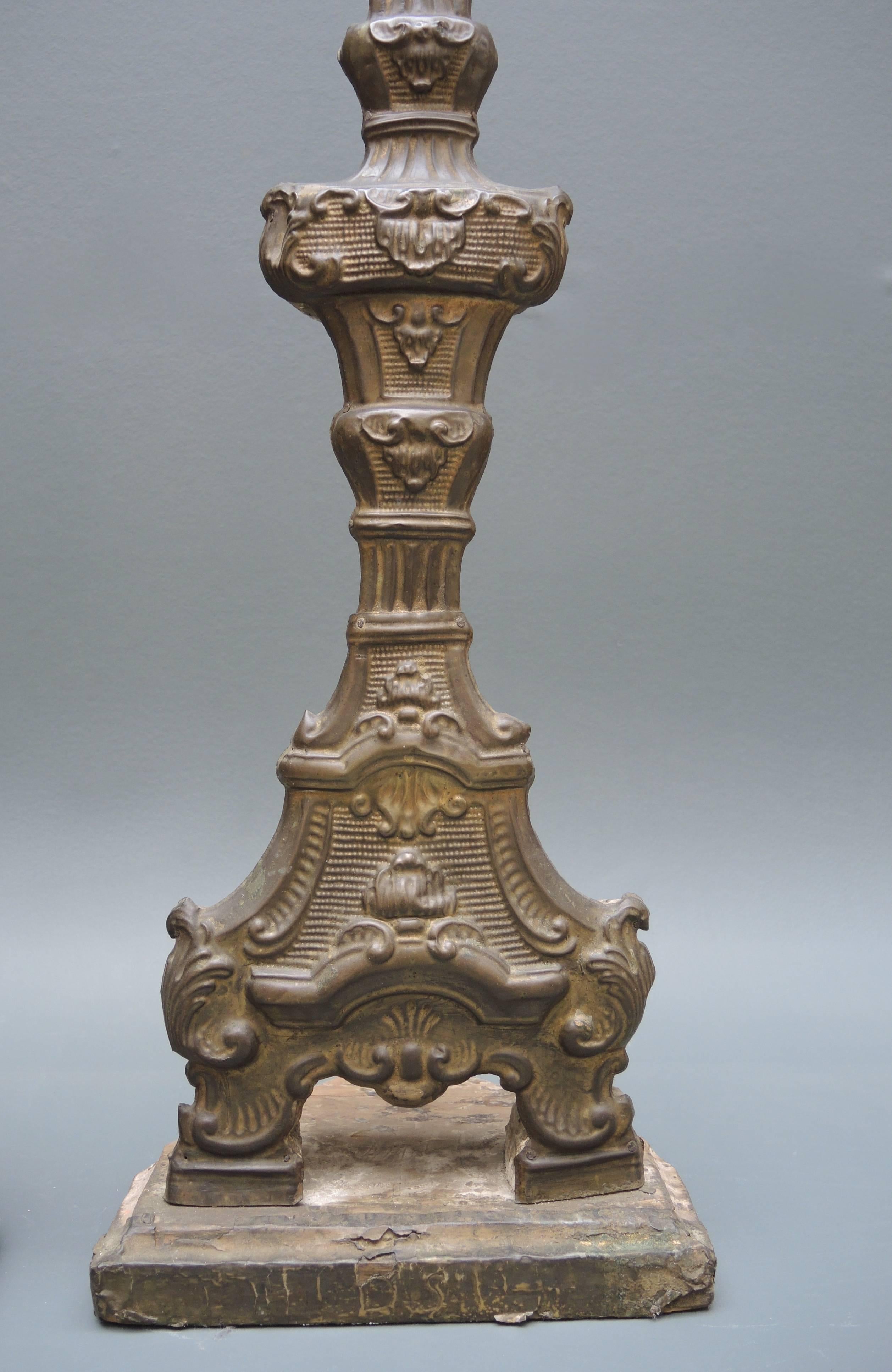 Repoussé Pair of 18th Century  Italian Altar Candlesticks in Repousse Brass And Wood For Sale