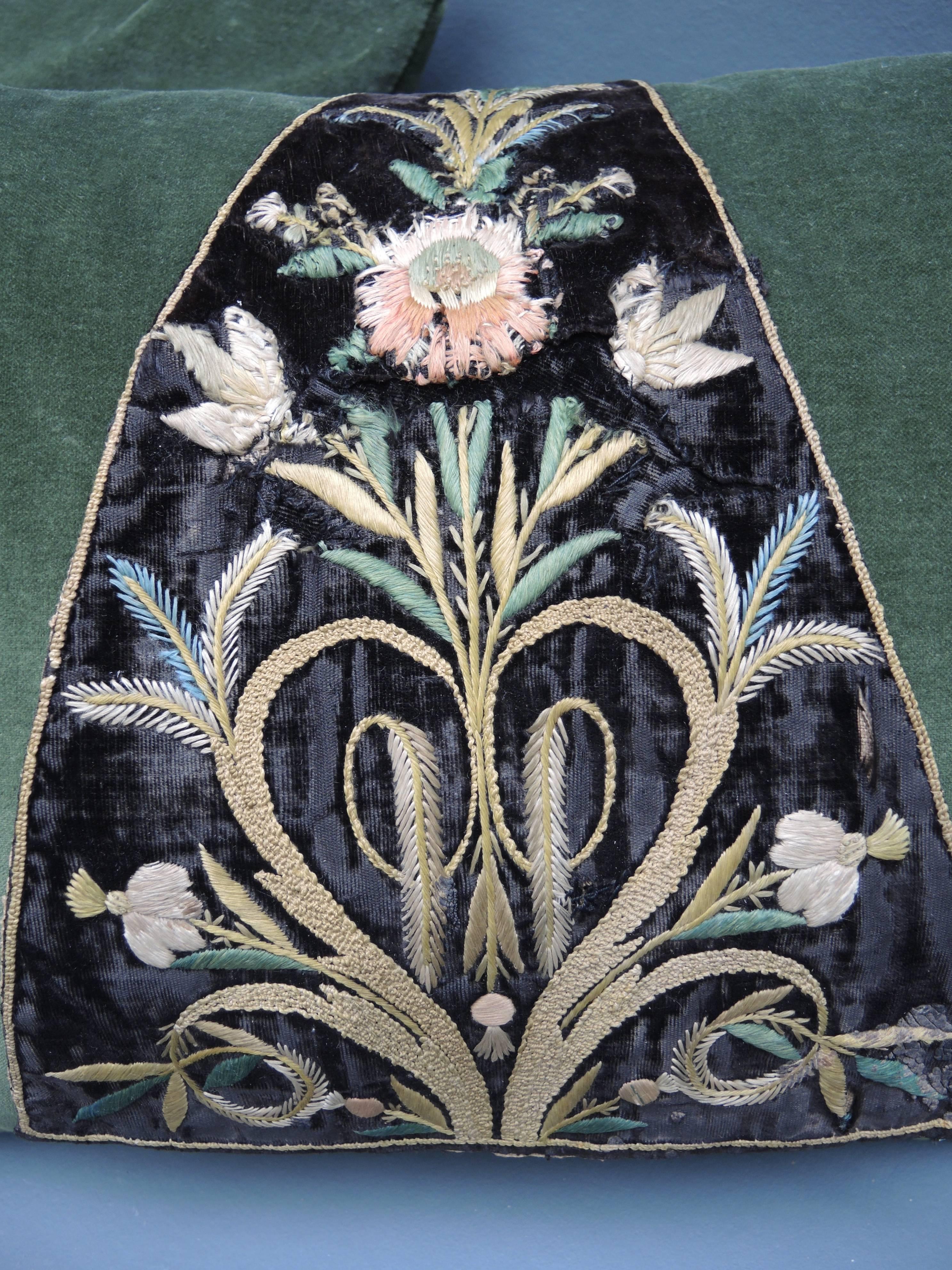 17th century French embroidered panels are finely embroidered using silk floss. The panels are sewn to cotton velvet feather filled pillows. There are a total of six pillows available in other colours of velvet. Priced each.