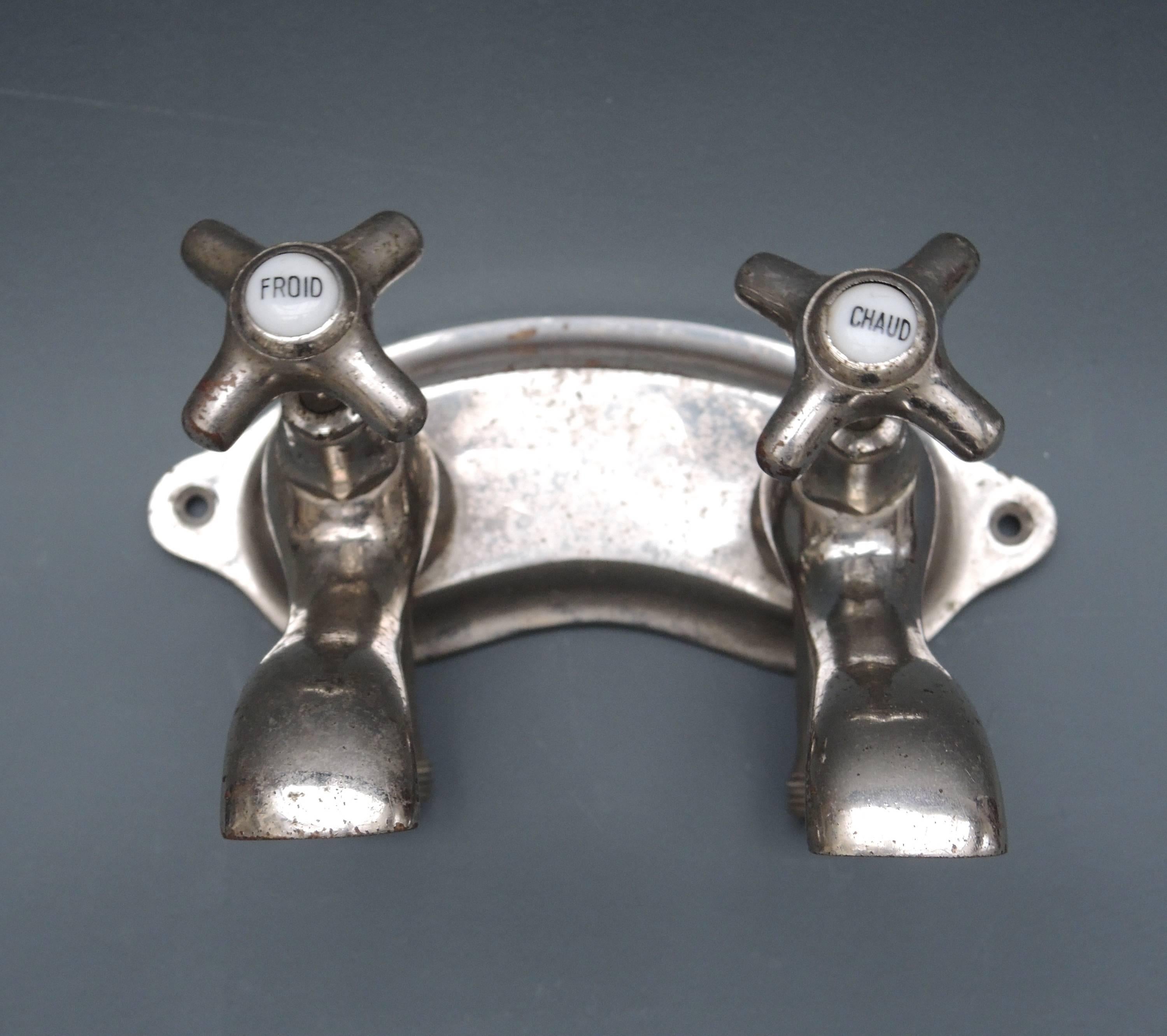 Vintage chromed wall mount faucet set from France. The handles have porcelain insets that read "Froid"(cold) and "Chaud"(hot)
The perfect way to add a bit of old world charm to your home.