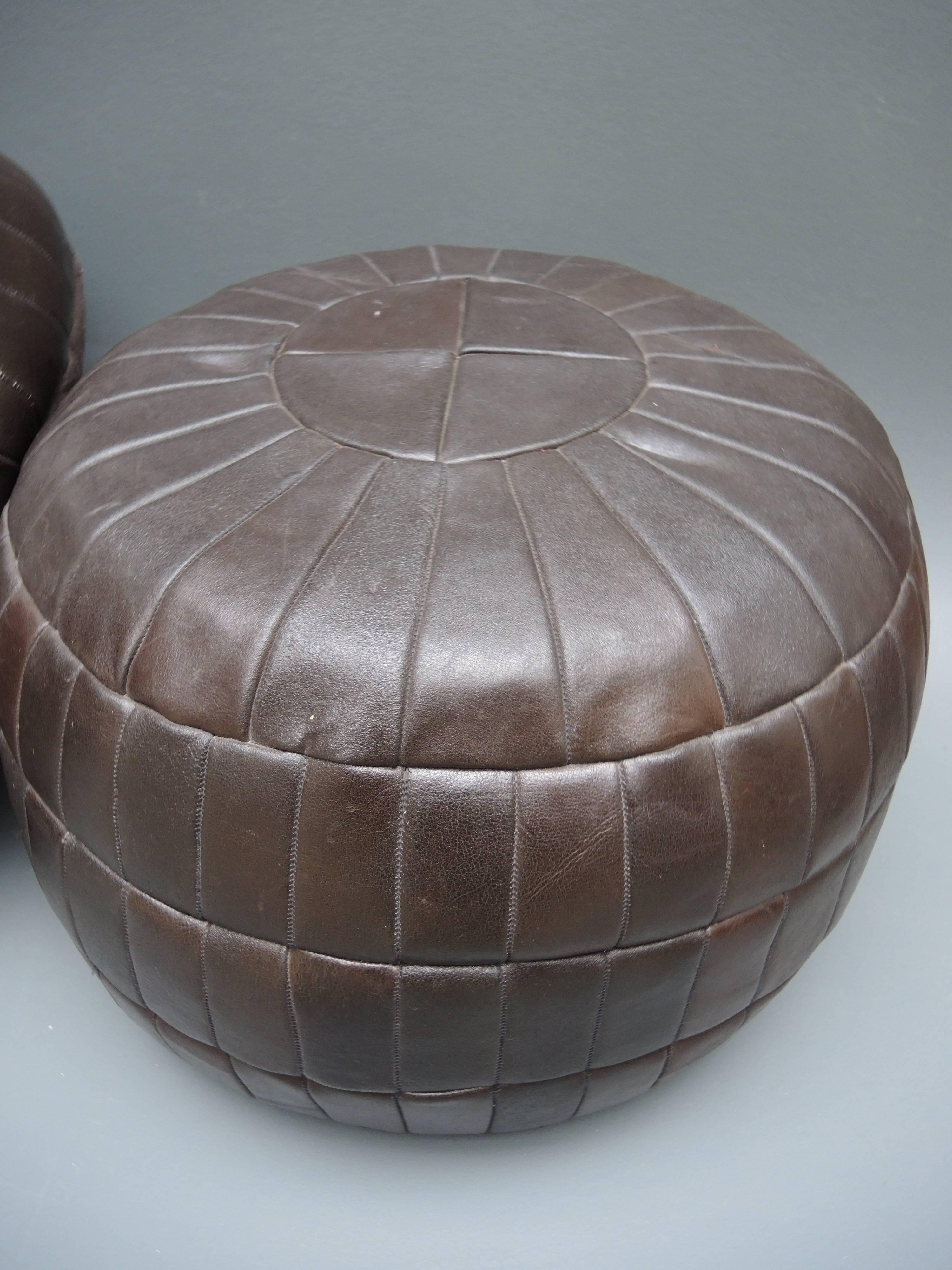 A very cool pair of chocolate brown leather ottoman 