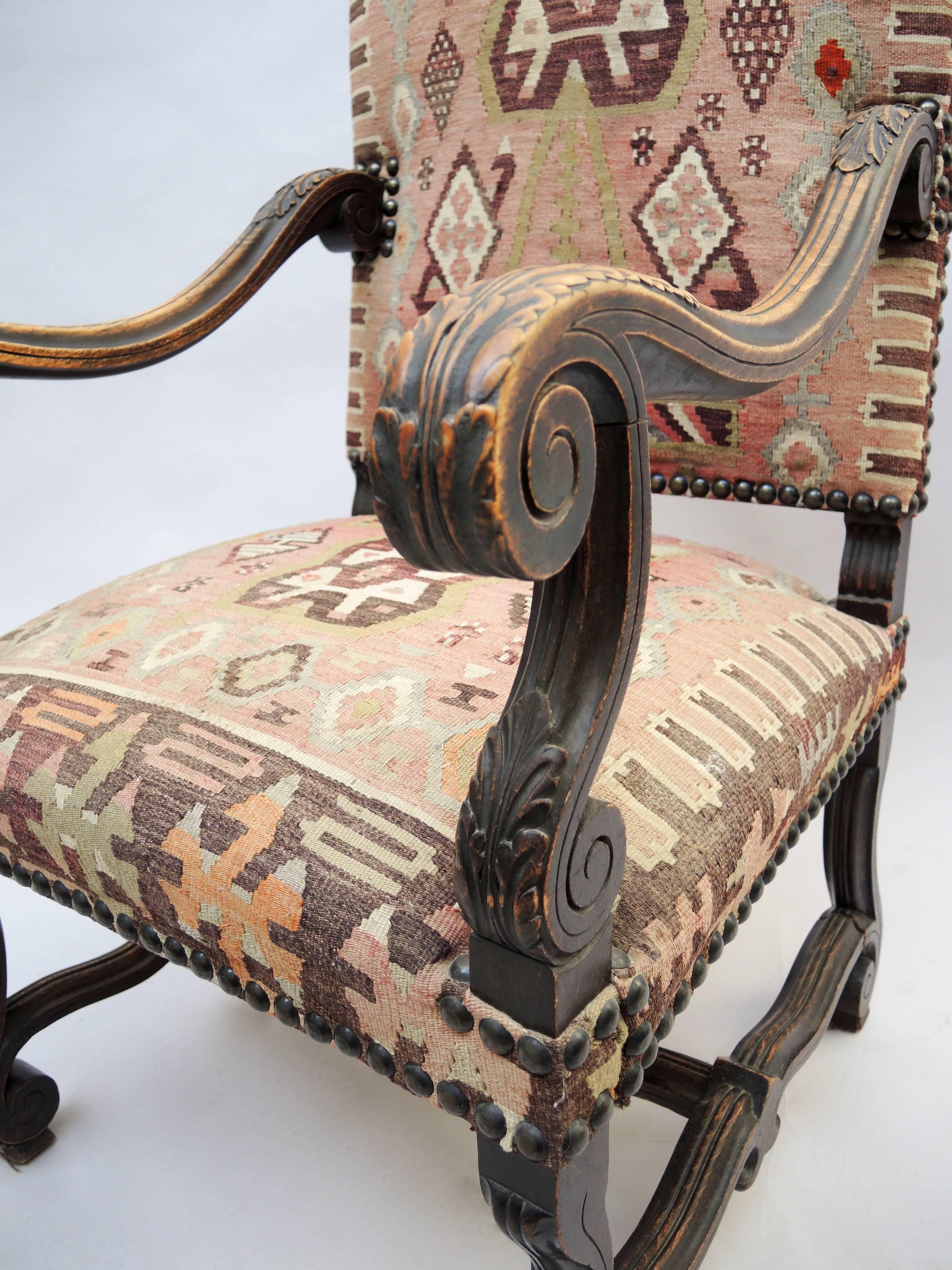 Very comfortable antique French Louis XIV armchair perfect height to use as a desk chair. Upholstered using a vintage Kilim carpet on the seat and back and finished on the reverse in velvet.