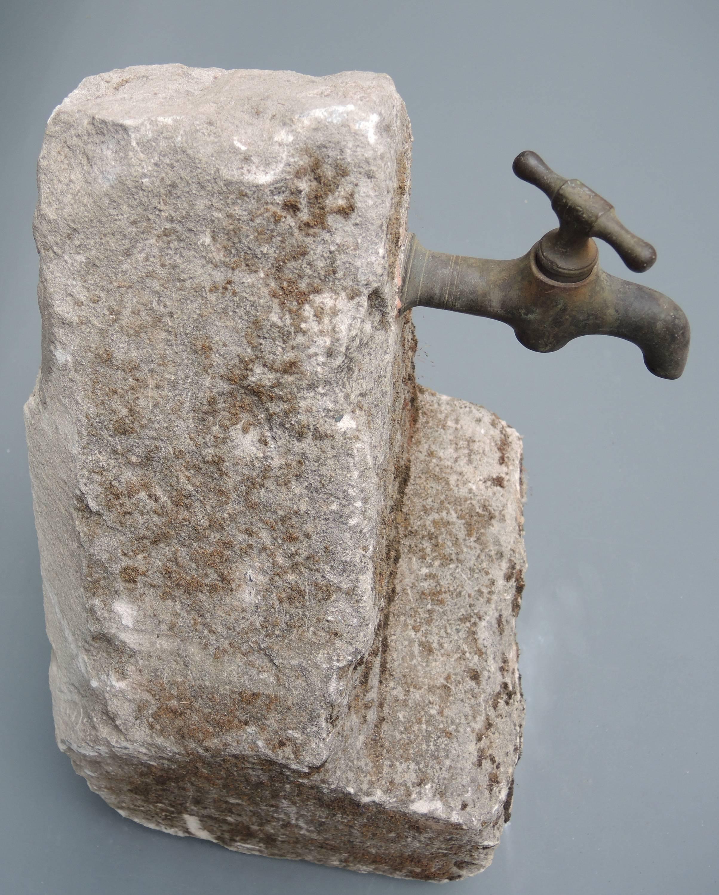 Mid-19th century French carved stone with bronze tap.