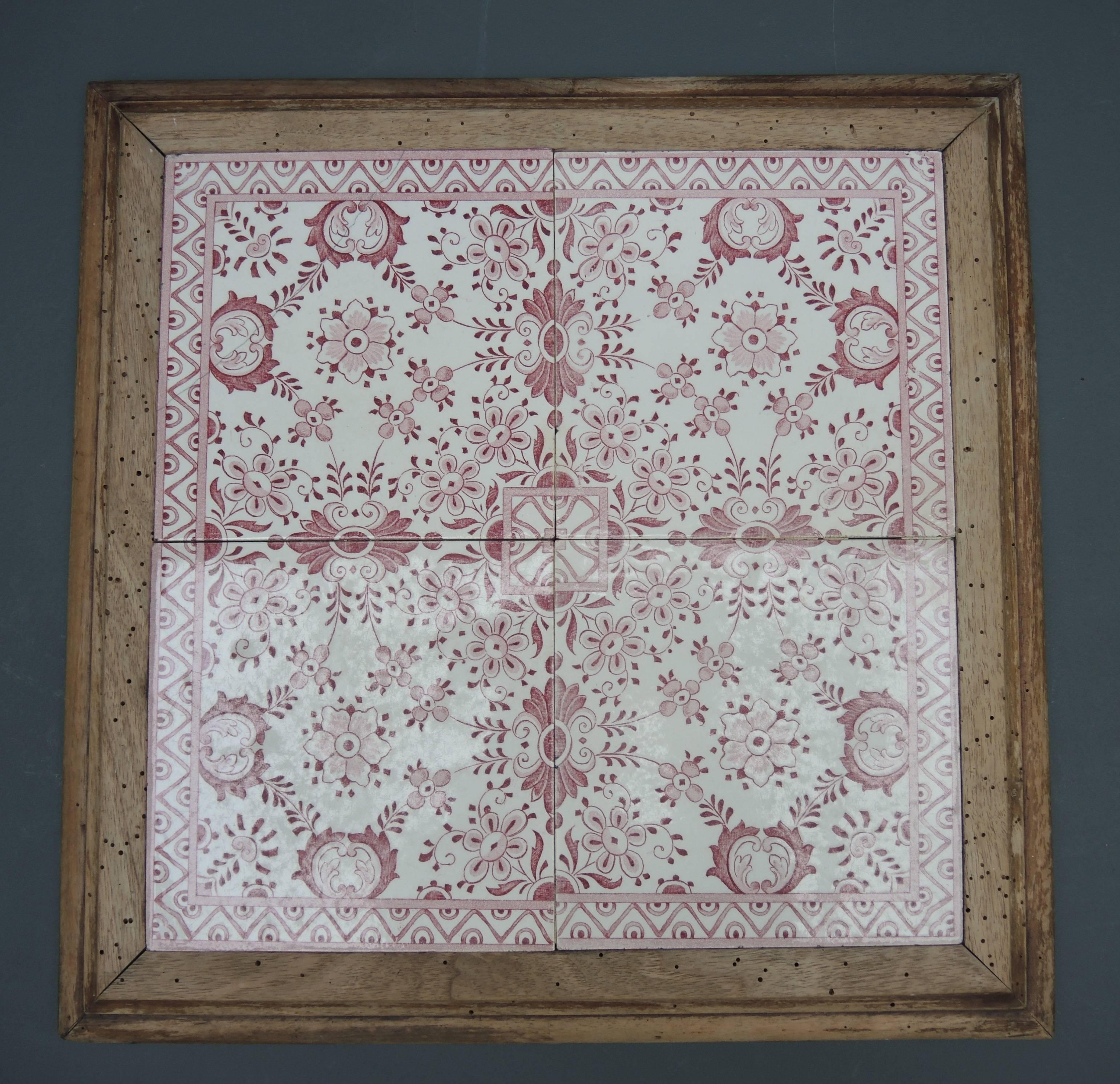 Red and white transfer ware tiles set into a oakwood frame lend the perfect country aire to this antique cheese serving tray from the Belgian countryside of West Flanders.