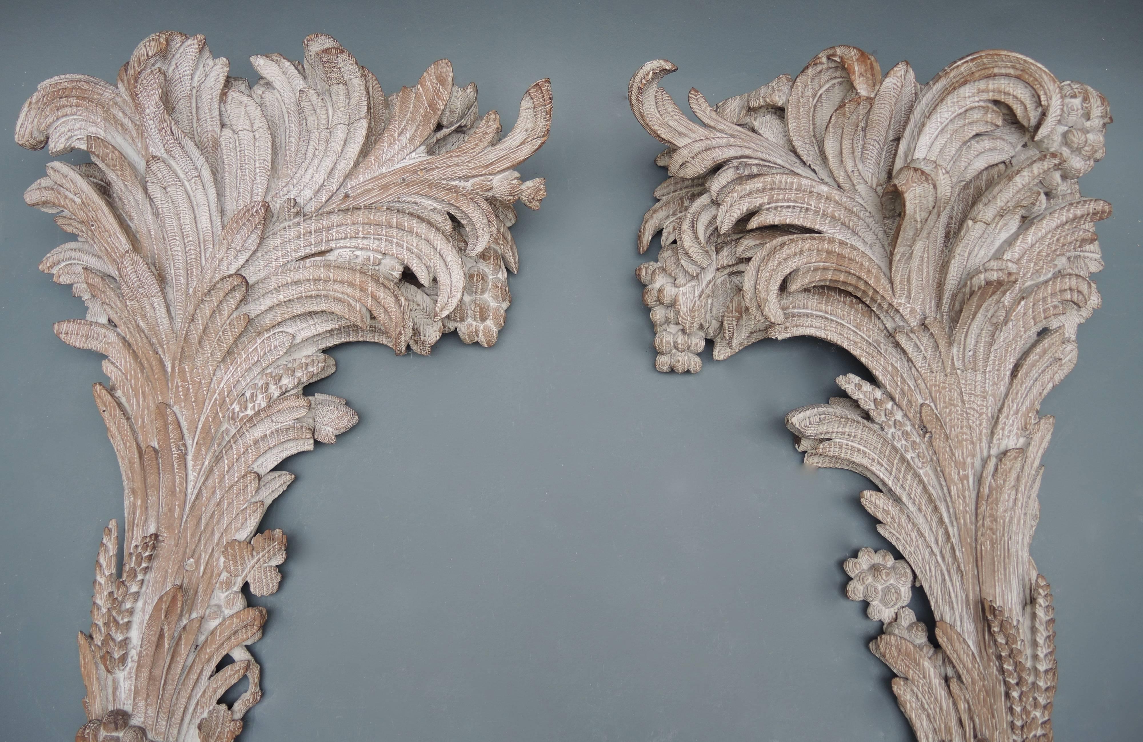 An exquisite pair of hand-carved limed oak pilasters originally fitted with electricity to uplight either side of the entrance of a Paris Apartment.
A wonderfully exotic French fantasy rendition of palm trees growing with grapes, wheat and ivy,they