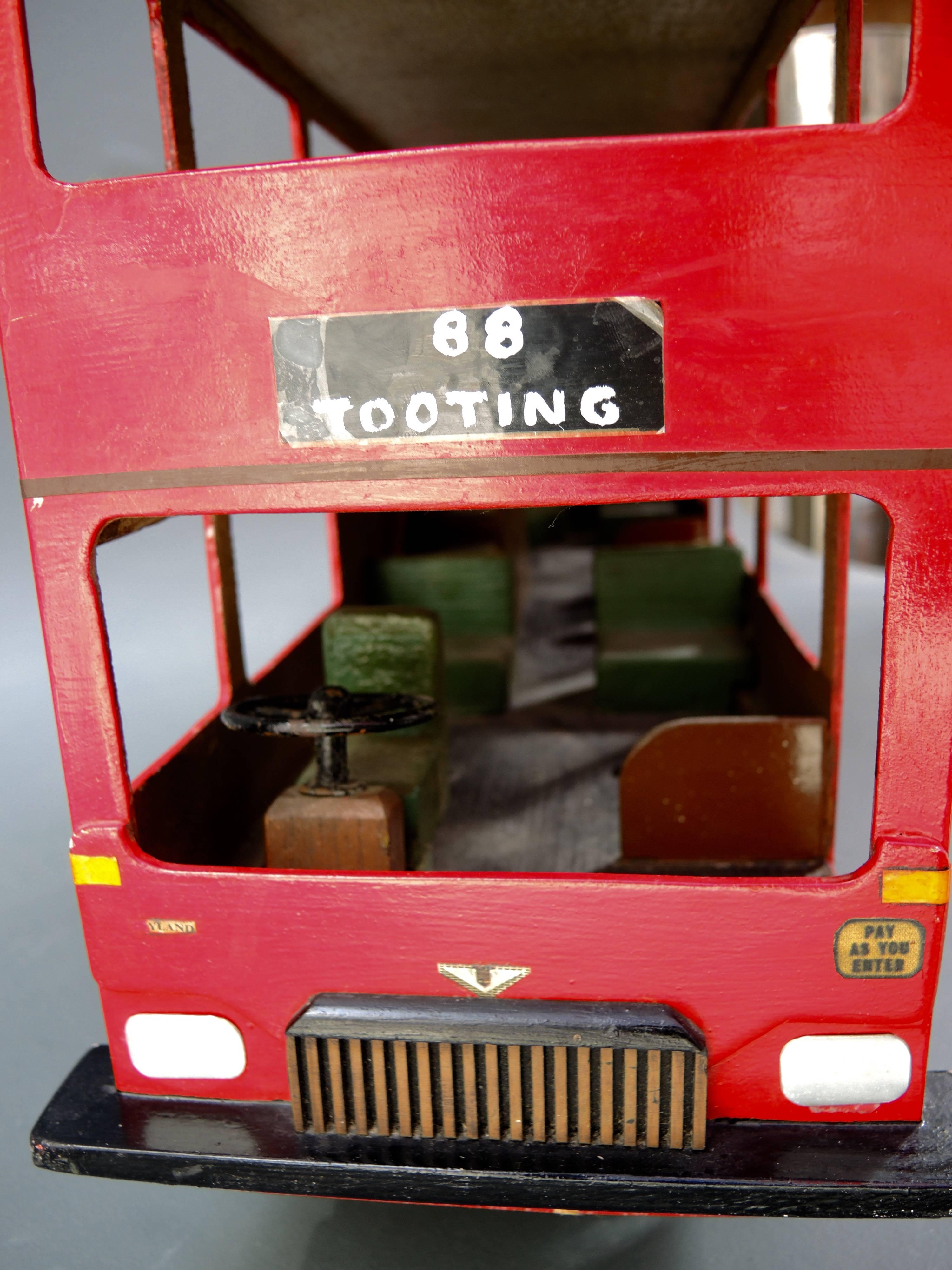 A very cool double decker English bus made in pressed board and wood, circa 1960.
Use it as a toy or display it for a shot of colour and Retro chic.
      