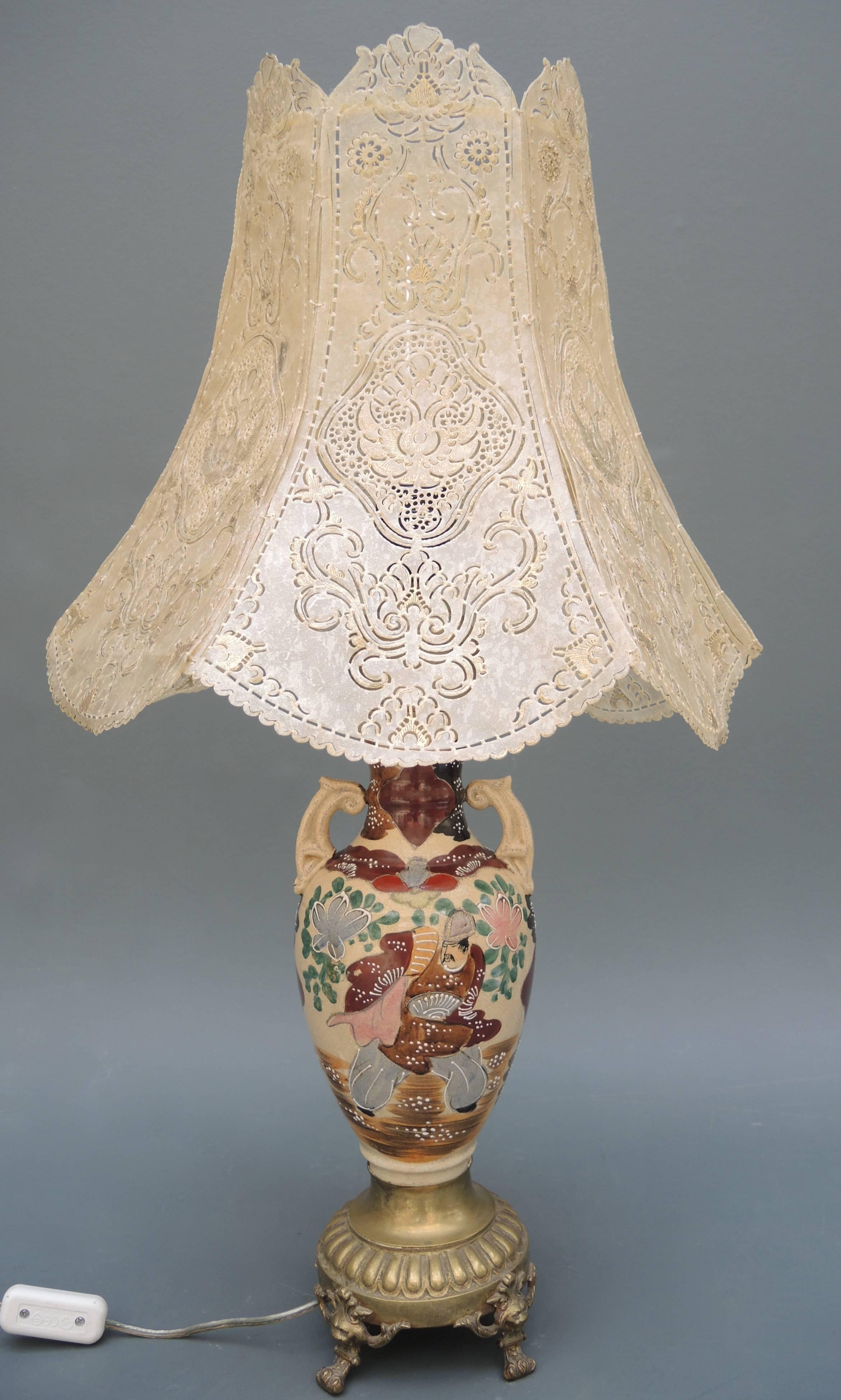 An elegant Japanese porcelain vase topped with the original vellum (calf skin) stencil cut lamp shade, circa 1930.
Newly wired and ready to use.