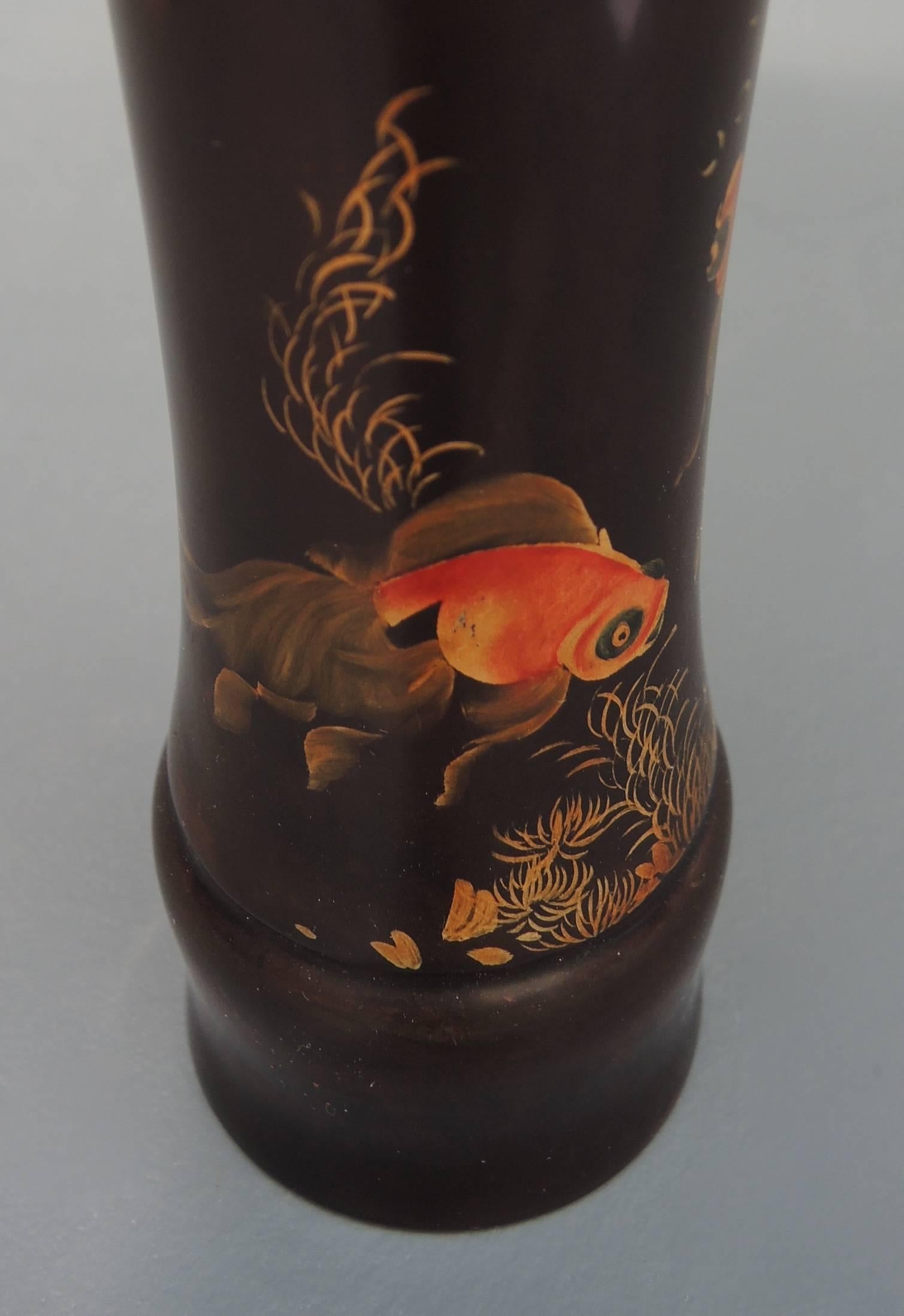 A hand lacquered Japanese wood vase gracefully painted with swimming fantail goldfish.