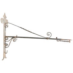 Antique French Wrought Iron Wall Bracket to Hold a Sign