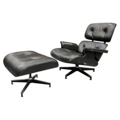 Anni '50: poltrona alta Eames e poggiapiedi di Herman Miller – Pelle nera