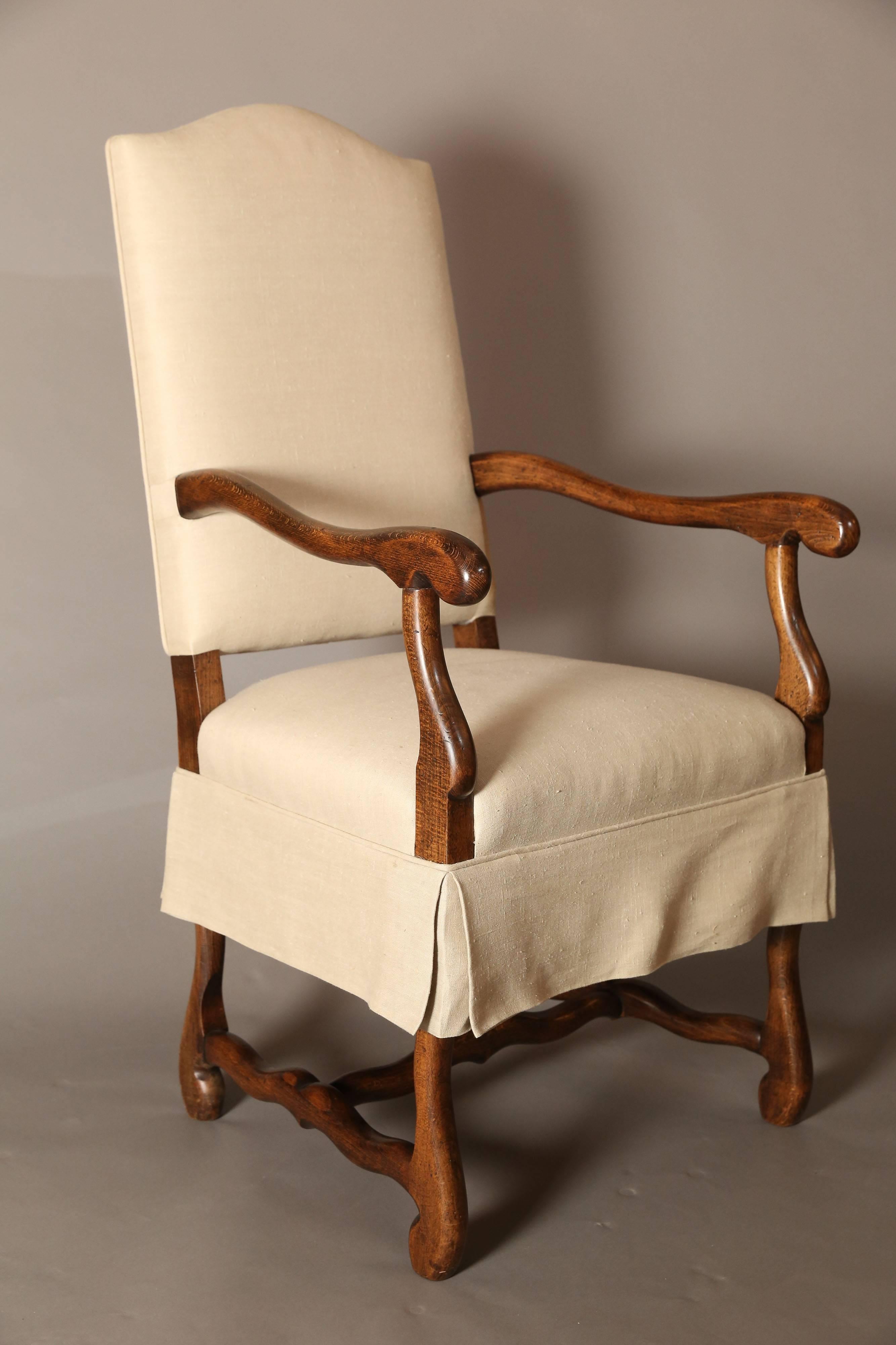 Fruitwood stained chair frames with handsome simple details.

White cotton slipcovers drop below seats and most of back.

 