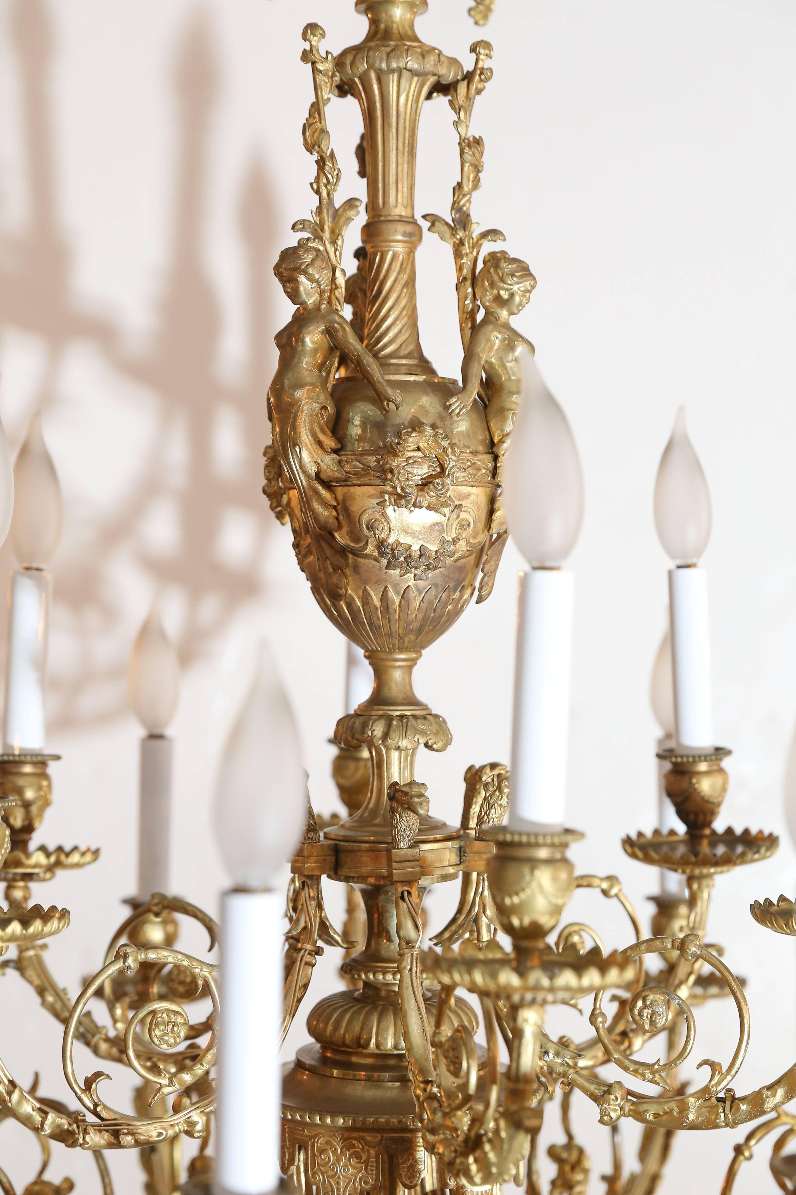 The details on this chandelier are exquisitely refined from the women figures on the top to the arms, bobeche and bottom finial.

Too many to describe.
Truly remarkable.
