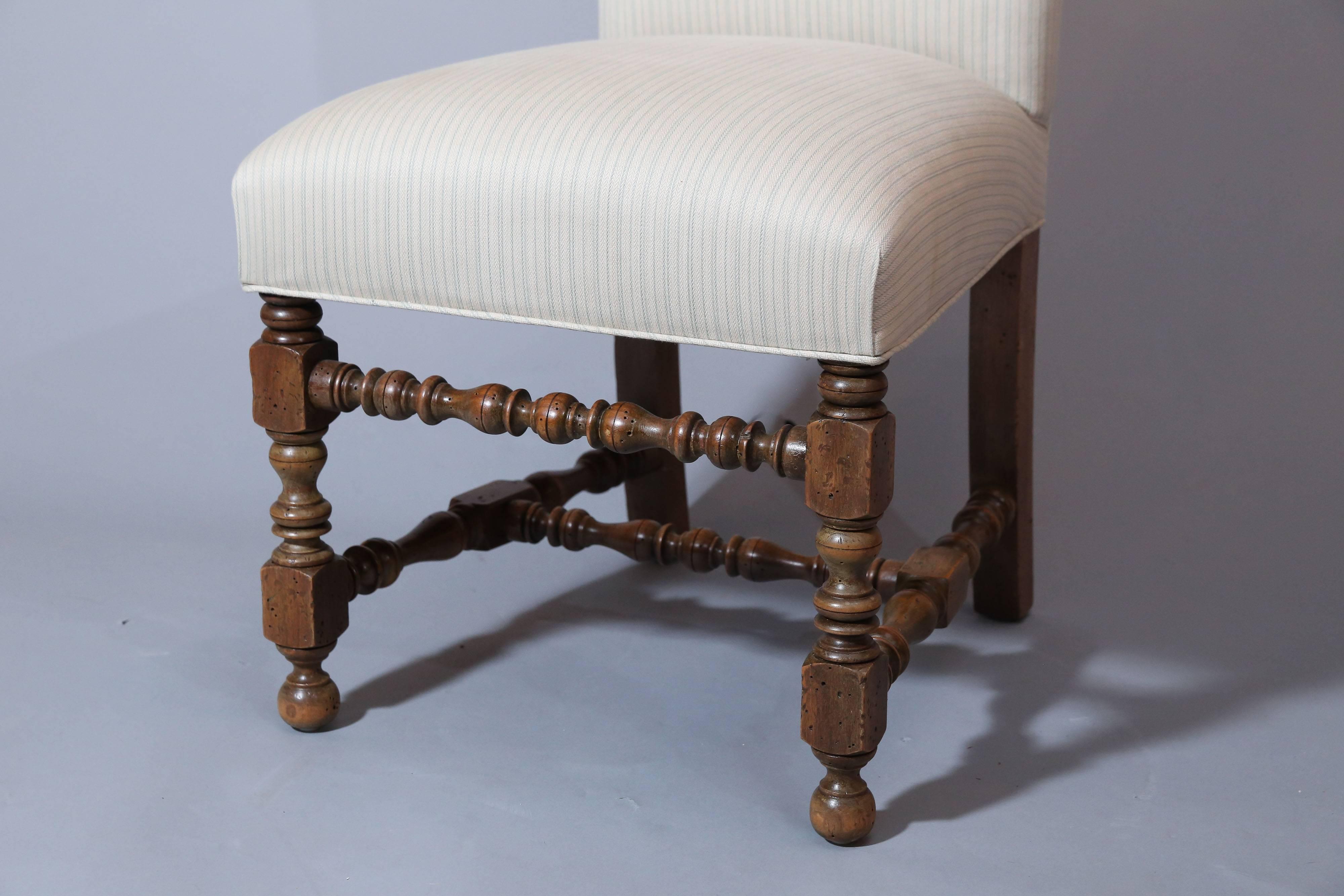 Set of six French Louis XIV-Style upholstered dining chairs have 
balustrade turnings on front legs and stretchers.
High back has a crest rail.